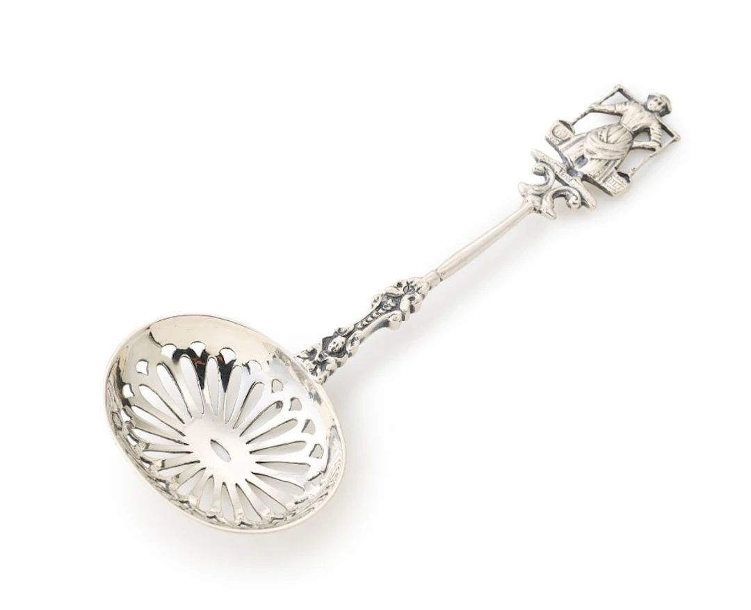 A Dutch silver sugar sifter, maker's mark B.V, .833 standard, 20th century