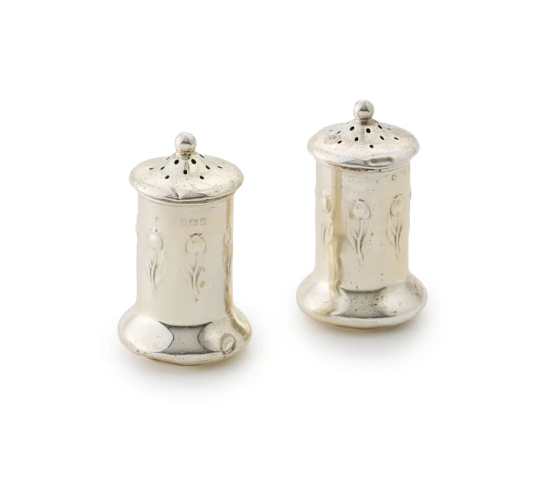 A pair of Edward VII silver salt and pepper pots, M & C Lister Ltd