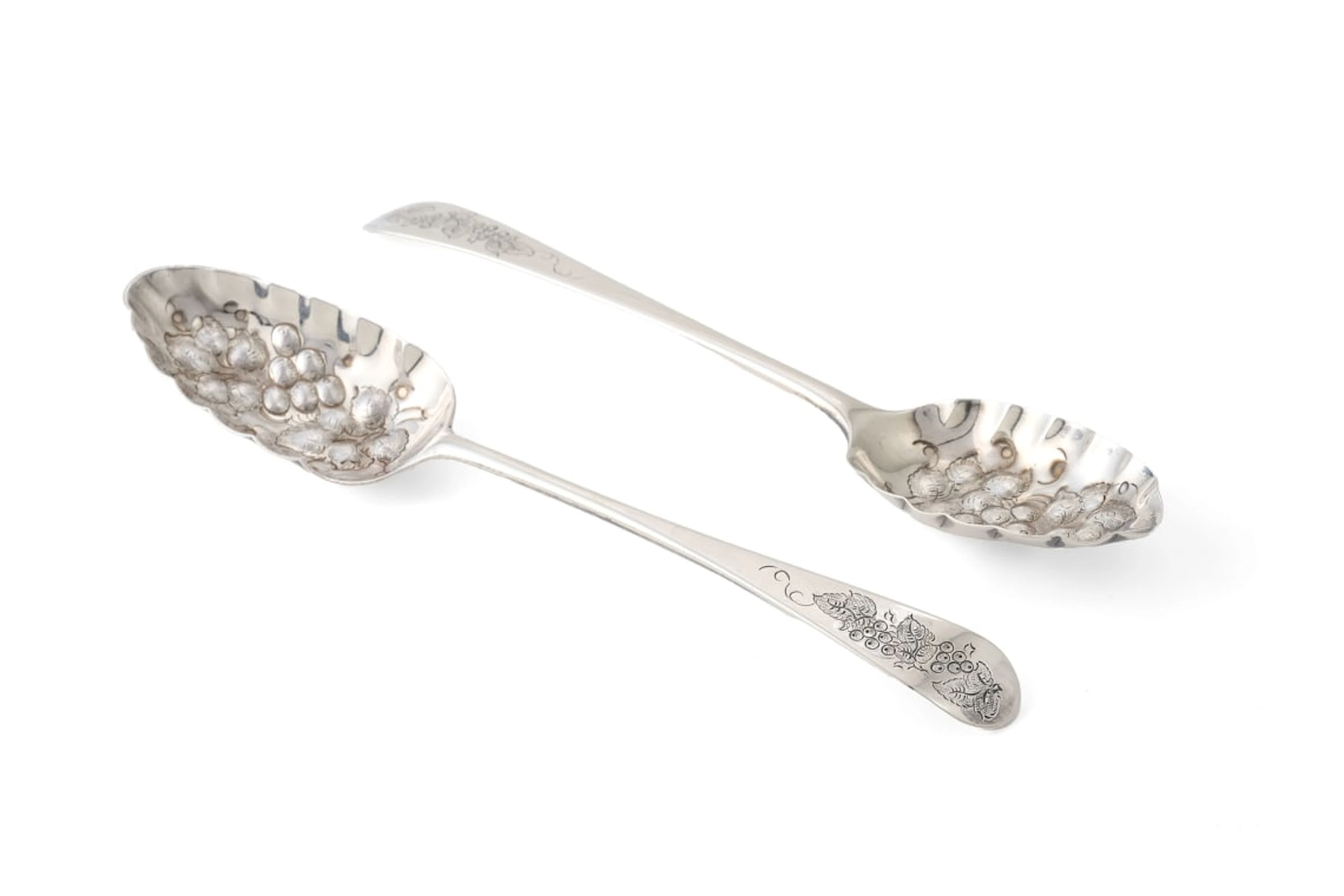 Two George III silver berry spoons, Hester Bateman and Thomas Wallis