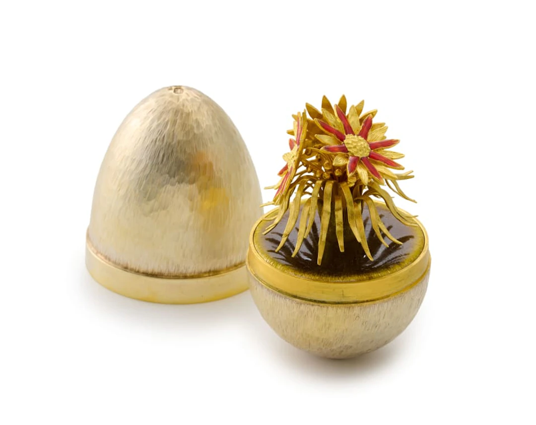 A Stuart Devlin silver-gilt and enamelled novelty surprise egg, London