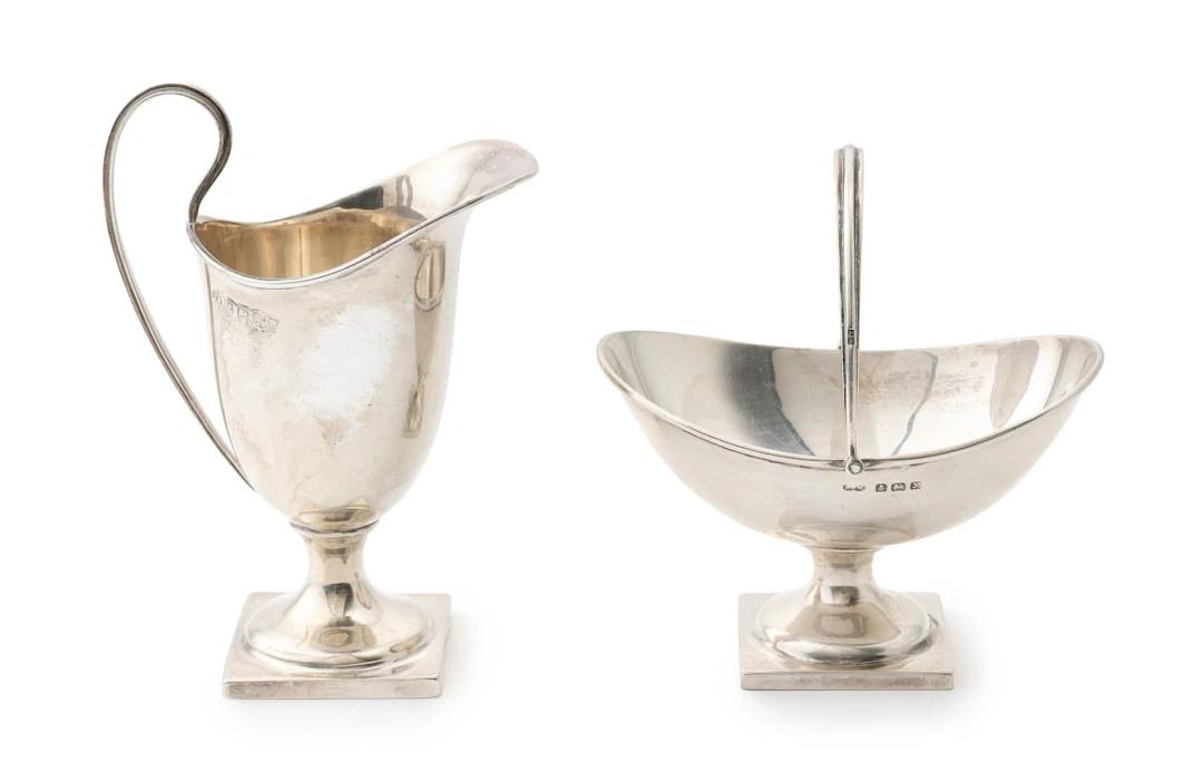 A George V silver milk jug and sugar bowl, T Wilkinson & Sons and