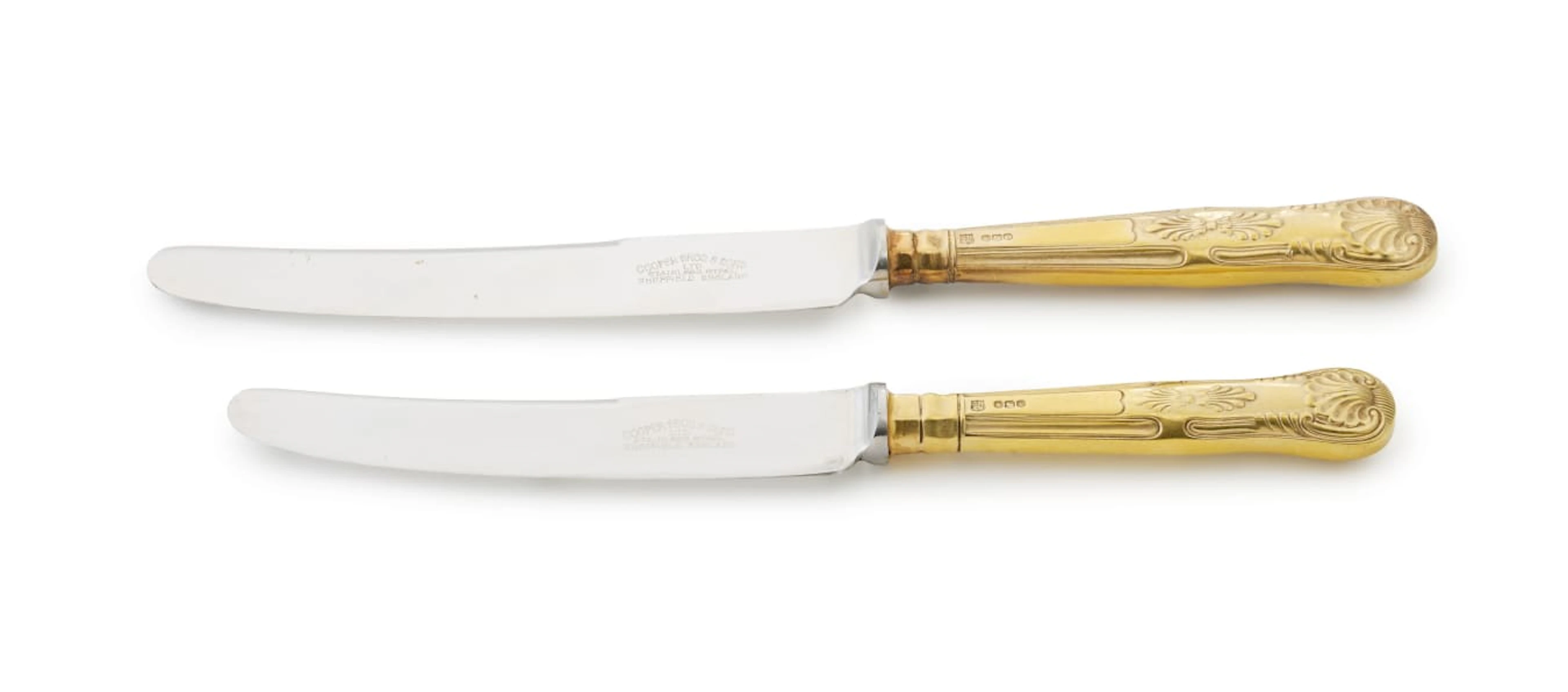 Sixteen Elizabeth II silver-gilt King's pattern knives, Cooper Brothers