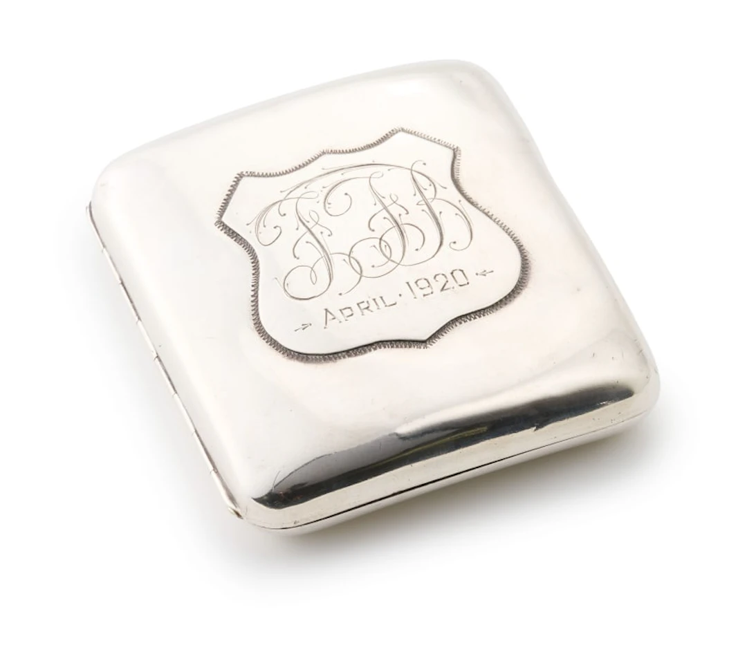 An Edward VII silver cigarette case, Cornelius Desormeaux Saunders