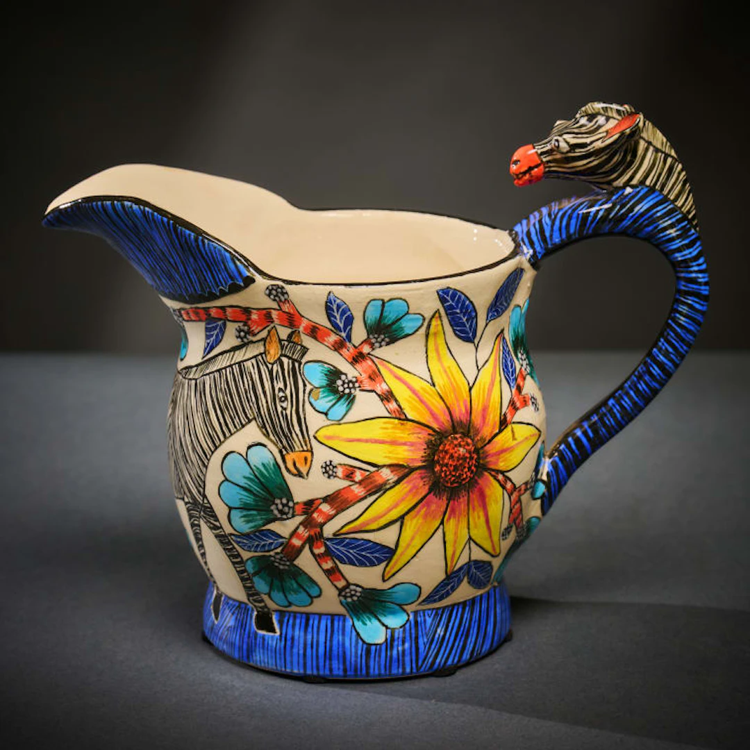 Ardmore Ceramic Studio; Zebra milk jug with yellow flowers