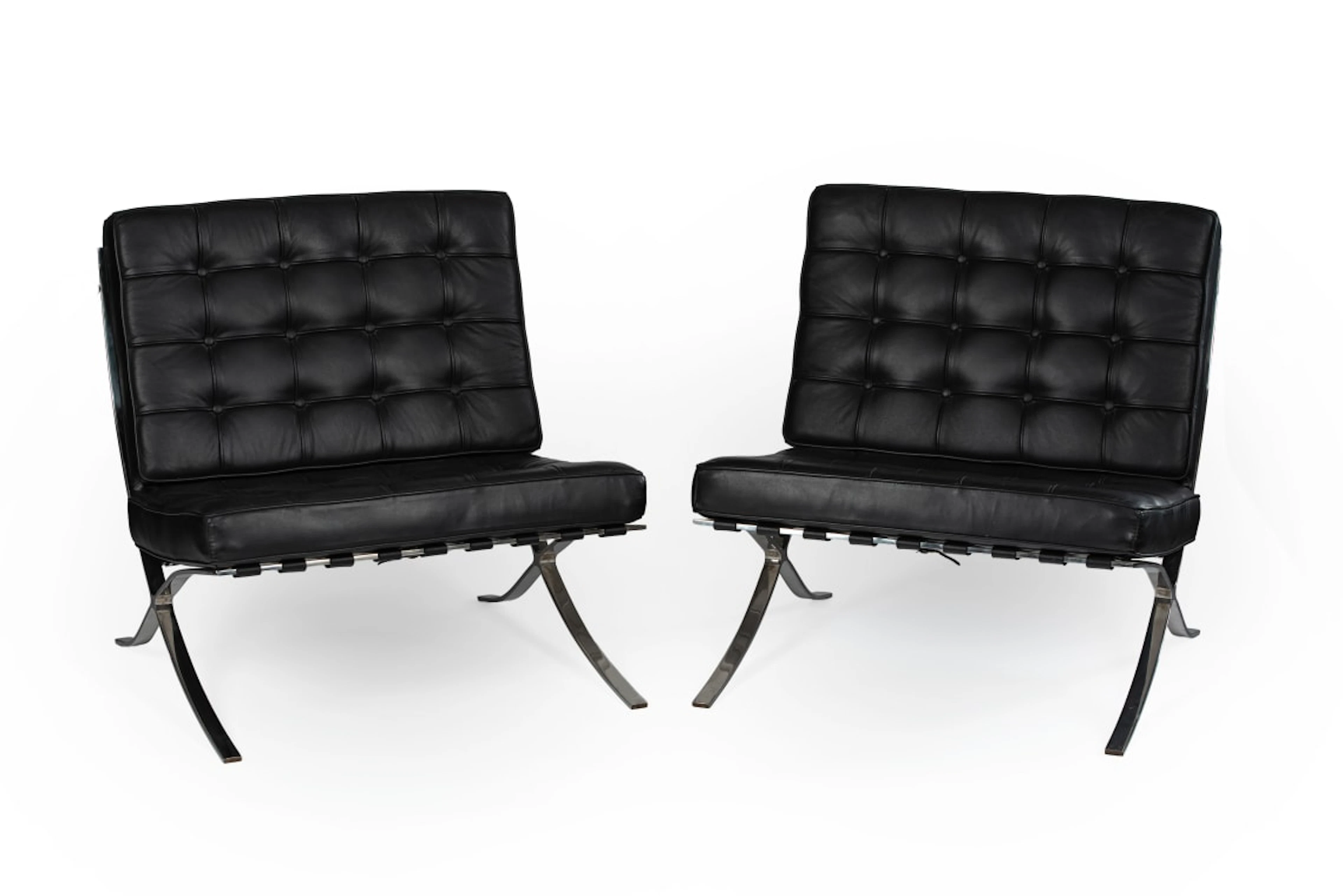 Ludwig Mies van der Rohe; Pair of black leather and chrome 'Barcelona'