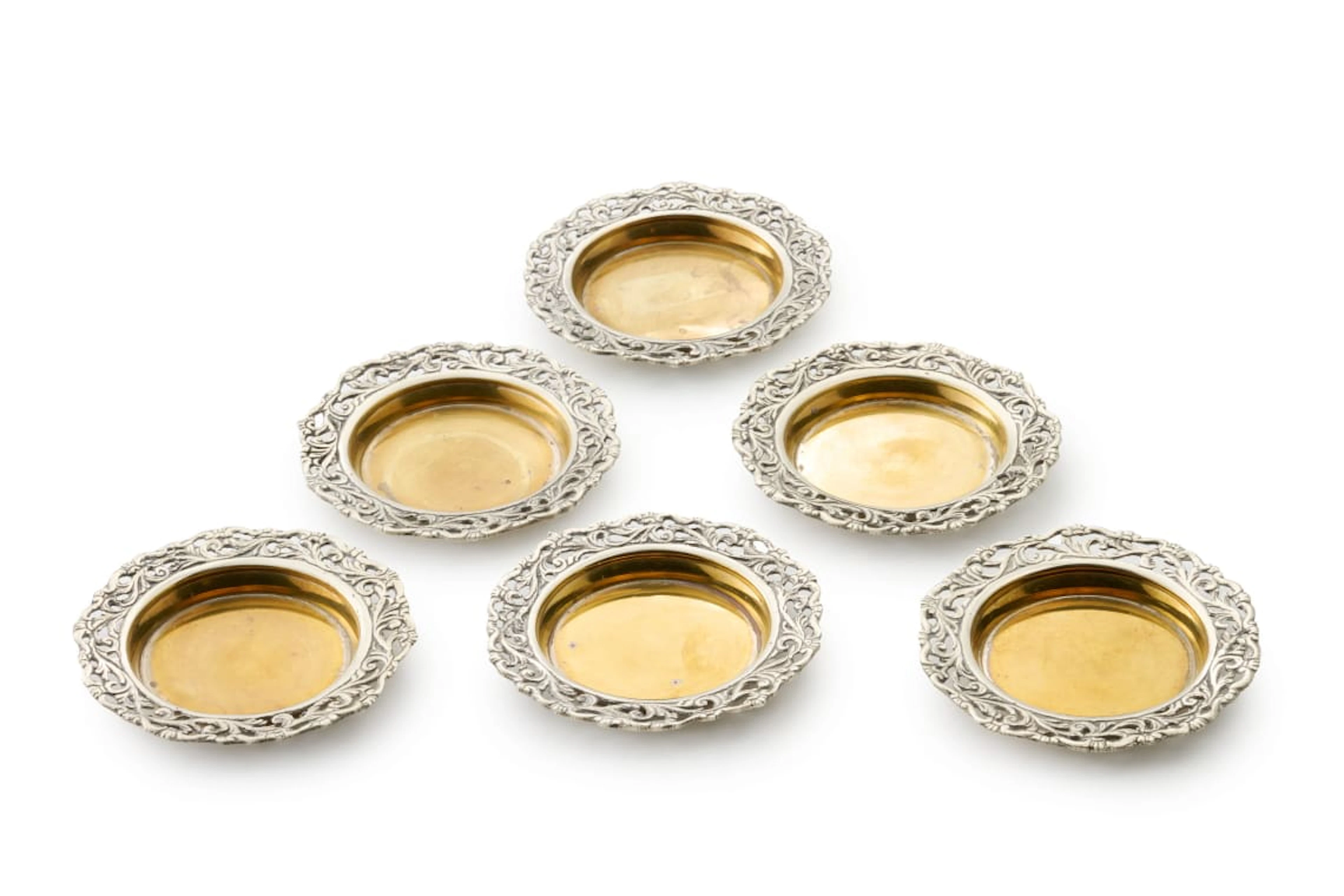 Six silver-plated coasters, late 19th/early 20th century
