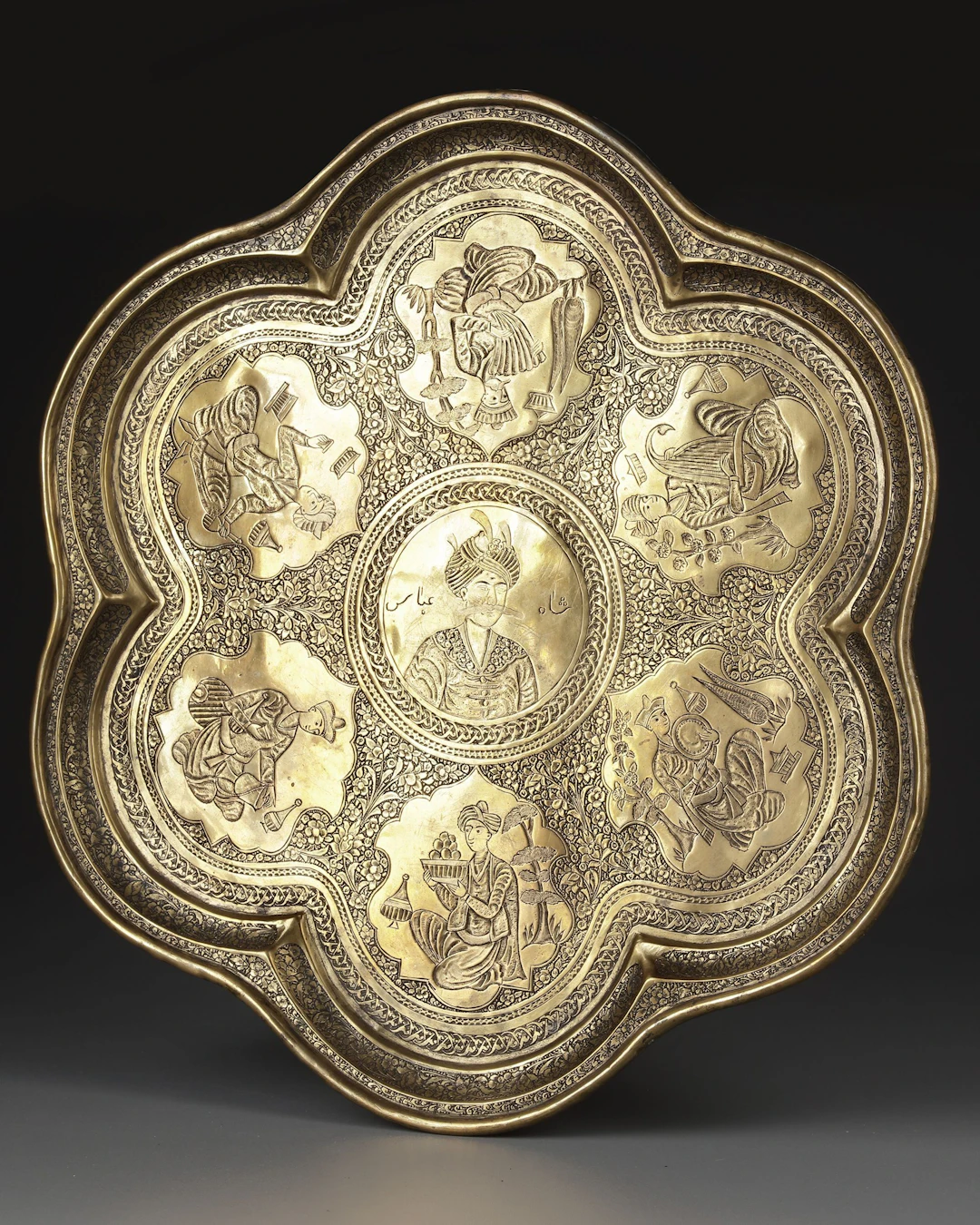 A QAJAR ENGRAVED BRASS TRAY DEPICTING SHAH ABBAS THE GREAT, PERSIA