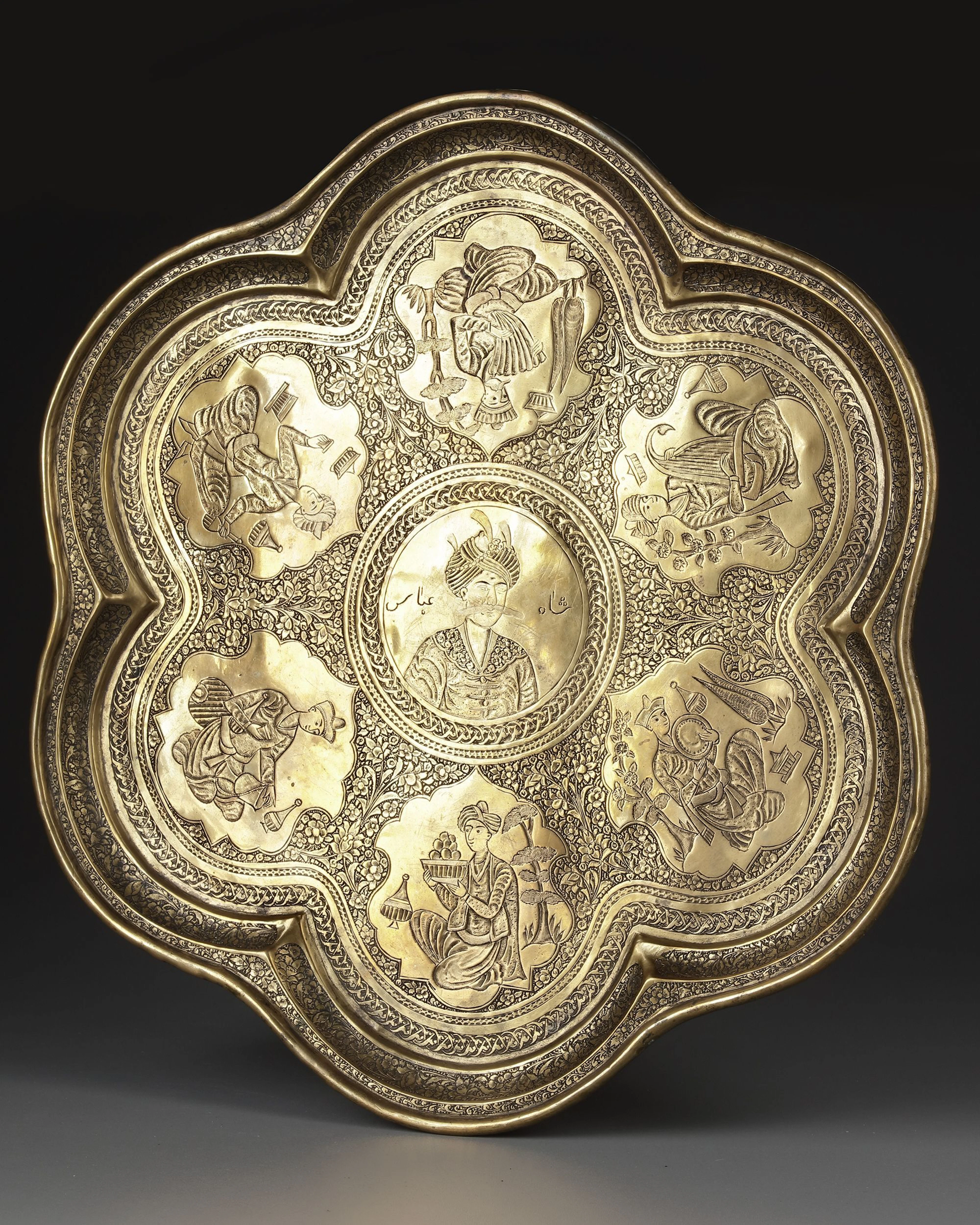 A QAJAR ENGRAVED BRASS TRAY DEPICTING SHAH ABBAS THE GREAT, PERSIA