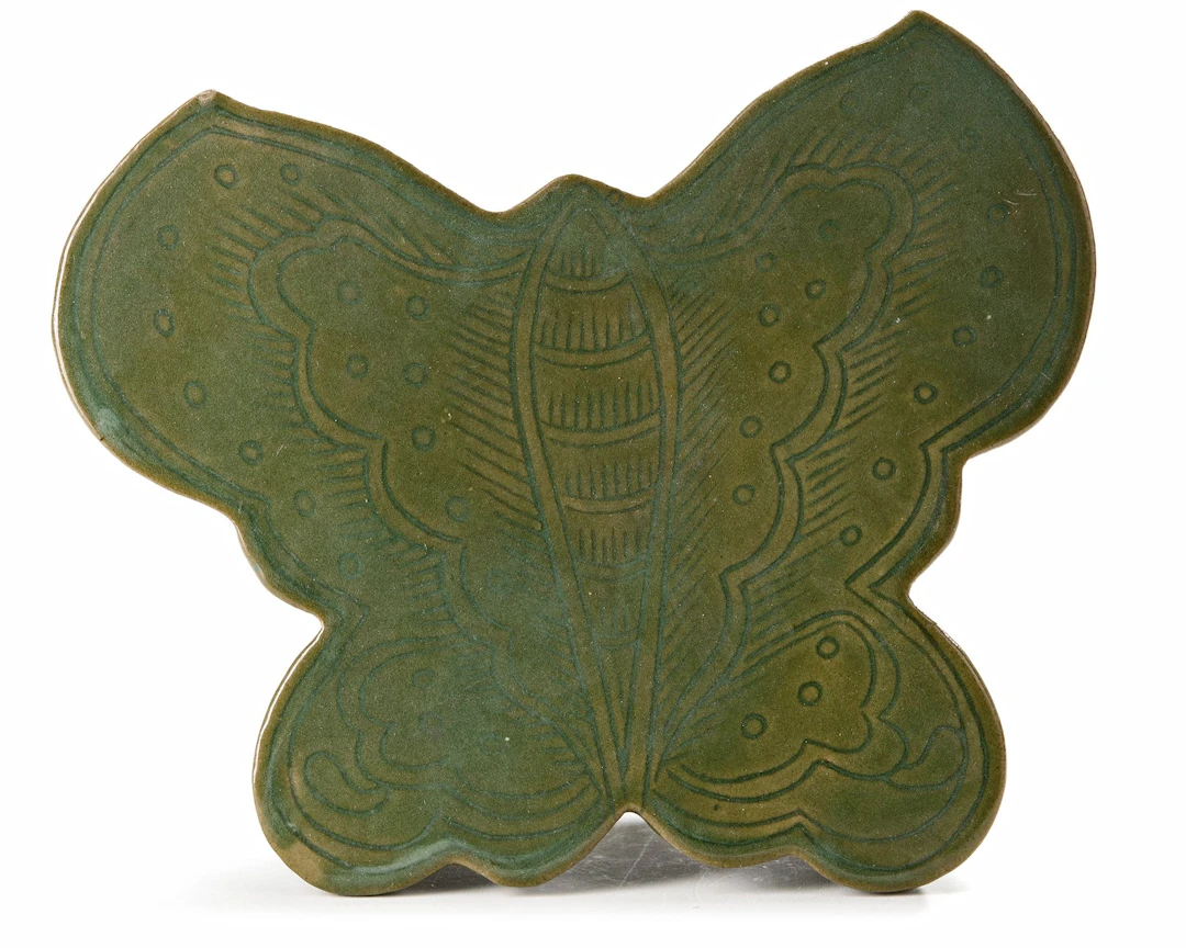 A CHINESE CELADON BUTTERFLY SHAPED PILLOW, 19TH CENTURY