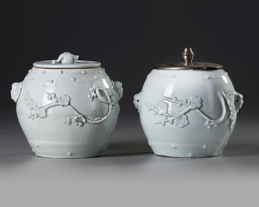 TWO CHINESE BLANC DE CHINE BARREL SHAPED JARS AND A COVER, 18TH CENTURY