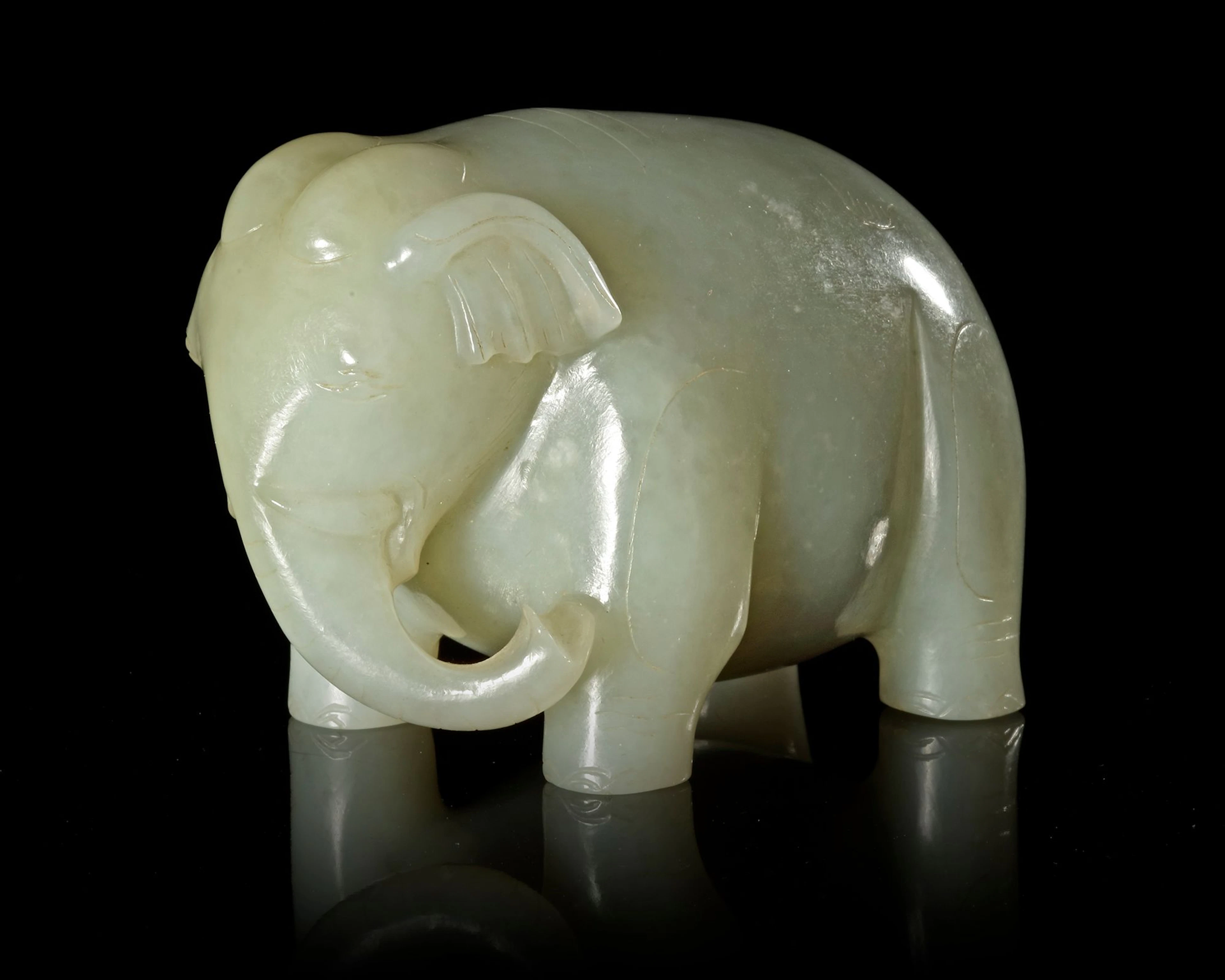 A GREYISH-WHITE JADE ELEPHANT, CHINA, HAN DYNASTY (206 BC-220 AD)