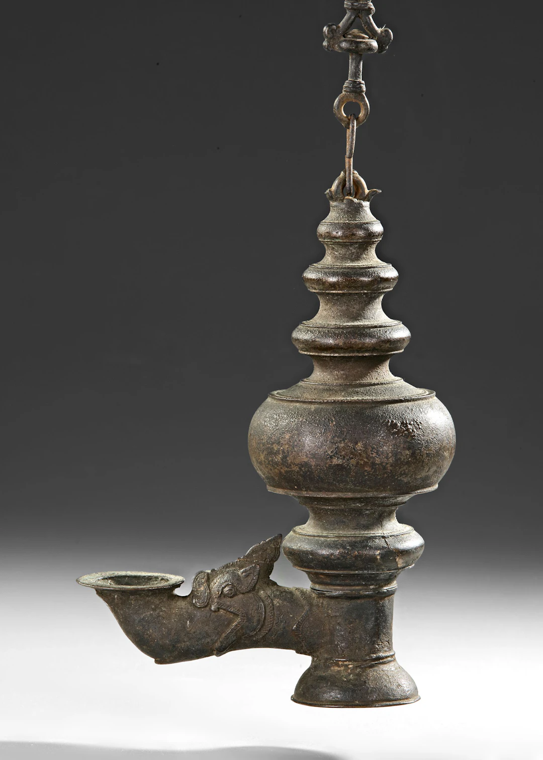 AN INDIAN TEMPLE BRONZE OIL LAMP, DECCAN OR SOUTH INDIA, 16TH-17TH CENTURY