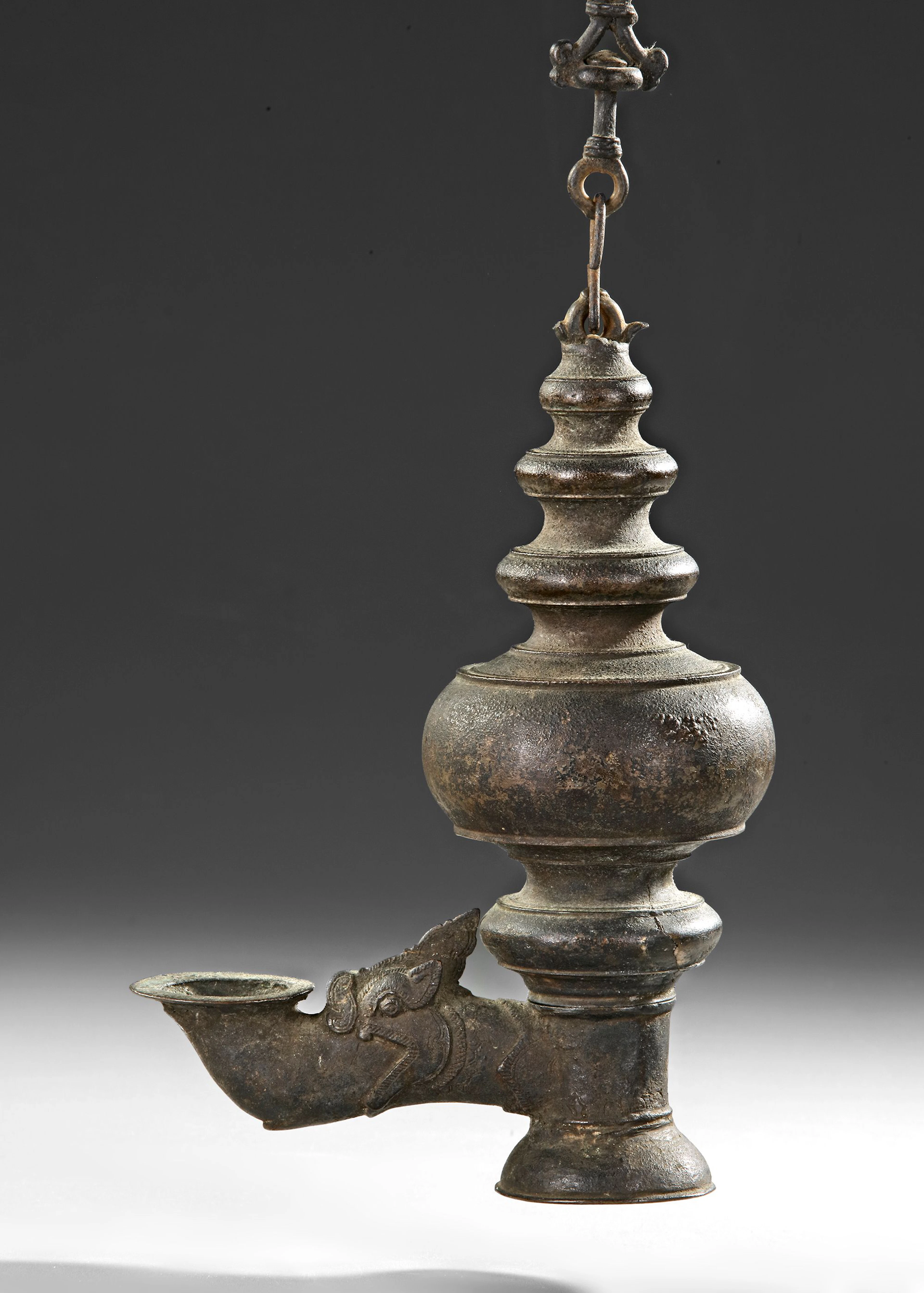 AN INDIAN TEMPLE BRONZE OIL LAMP, DECCAN OR SOUTH INDIA, 16TH-17TH CENTURY