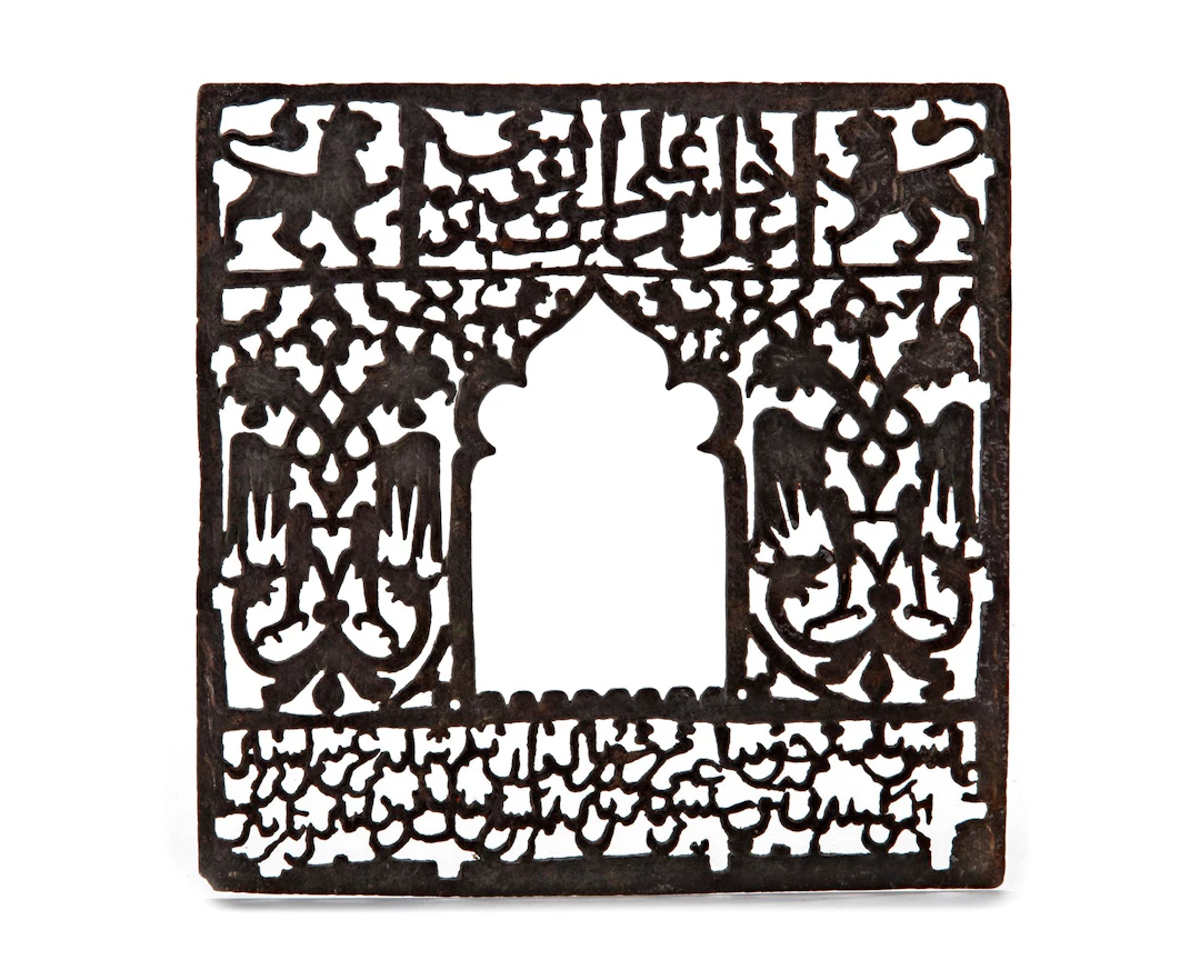 A SELJUK PIERCED STEEL GRAVE PANEL, DATED 409 AH/1018 AD