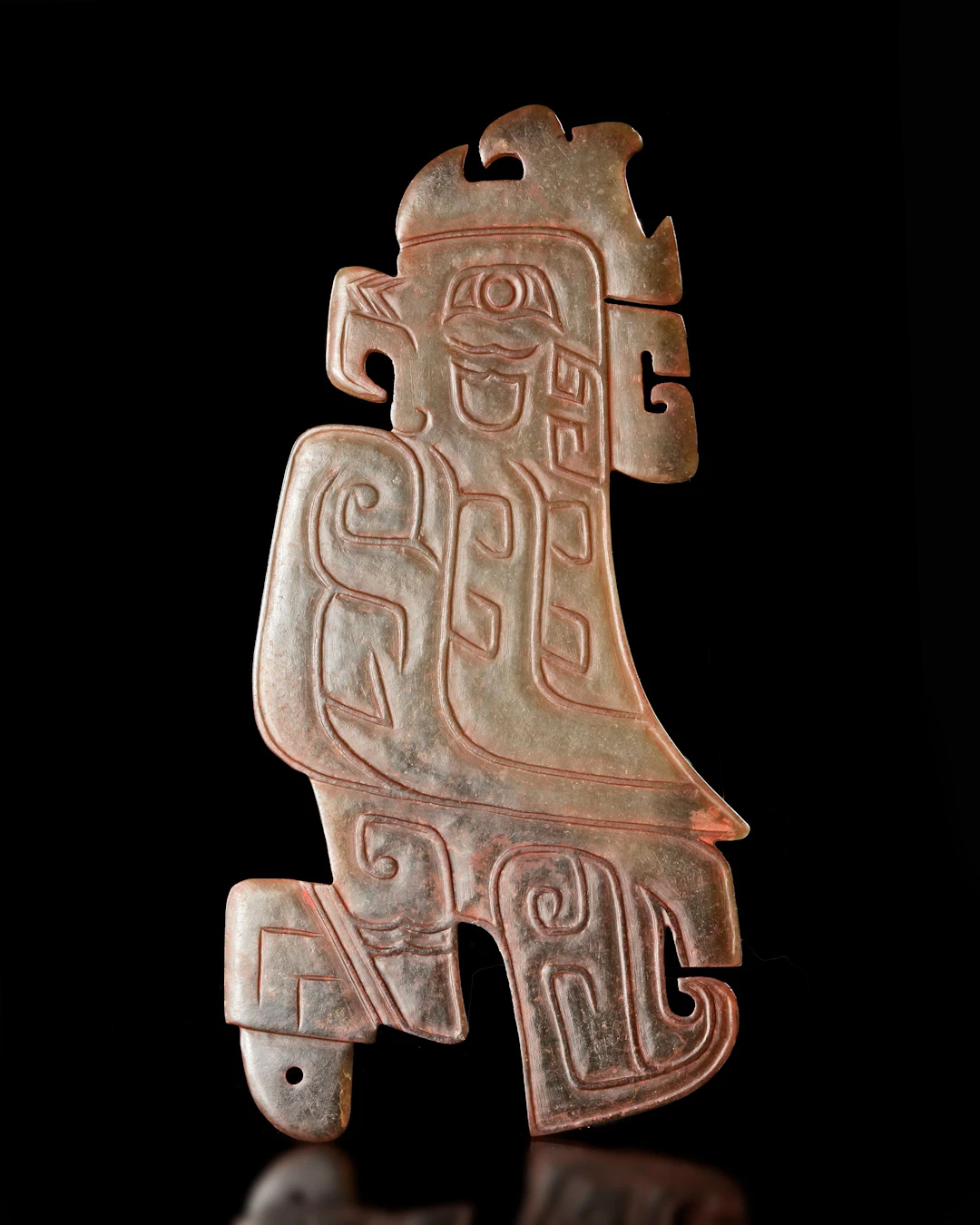 A CHINESE JADE OF A PARROT, SHANG DYNASTY (c 1600-1046 BC)