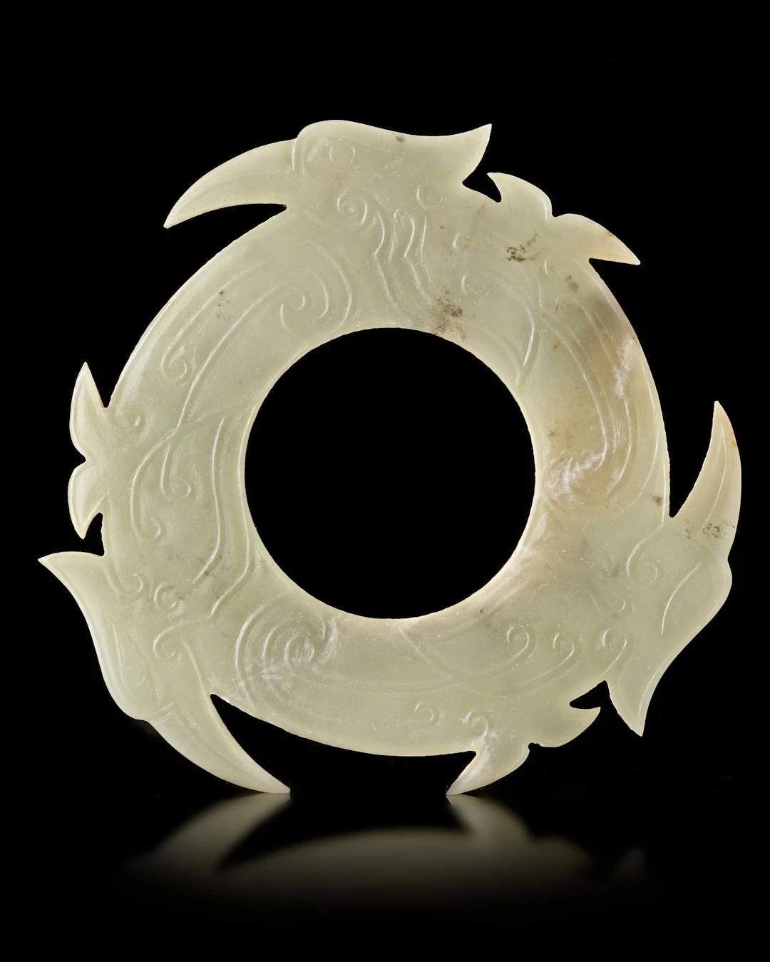 A LIGHT CELADON CHINESE JADE XUANJI, SHANG DYNASTY (c. 1600–1046 BC)
