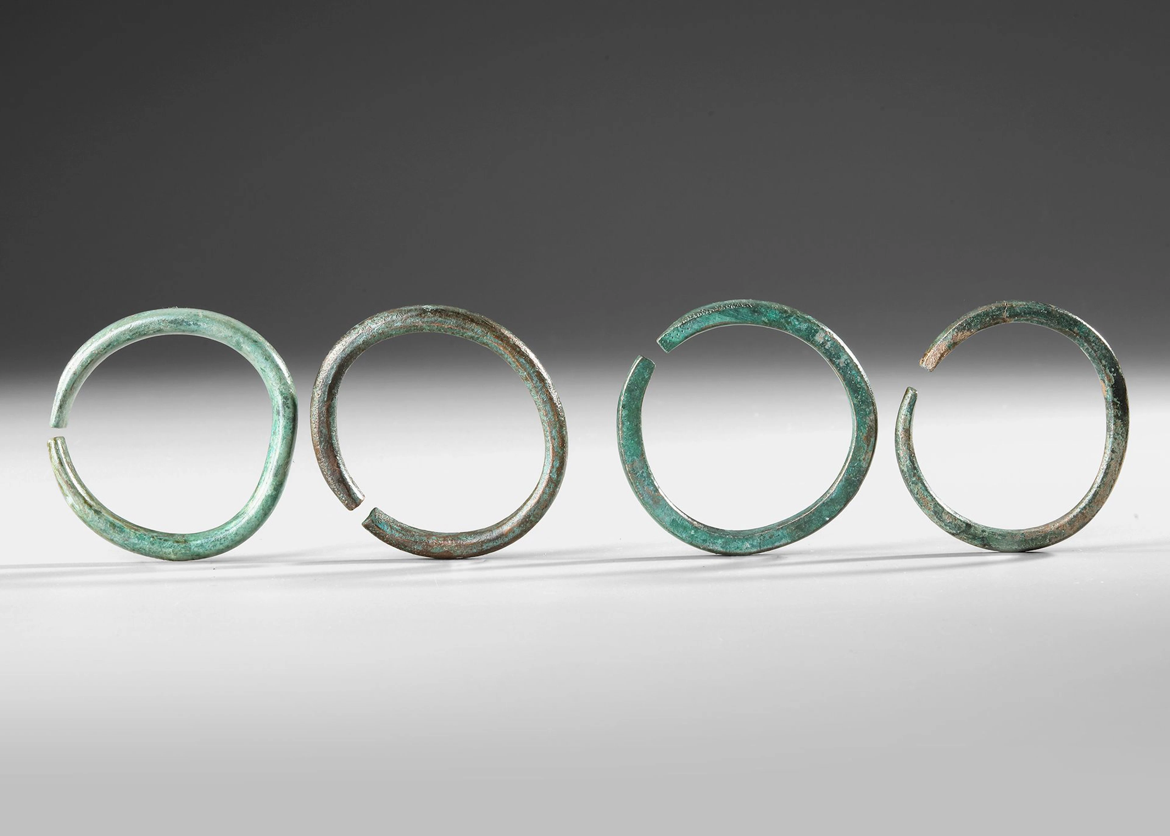 FOUR BRONZE BRACELETS, BRONZE AGE, 7TH CENTURY BC