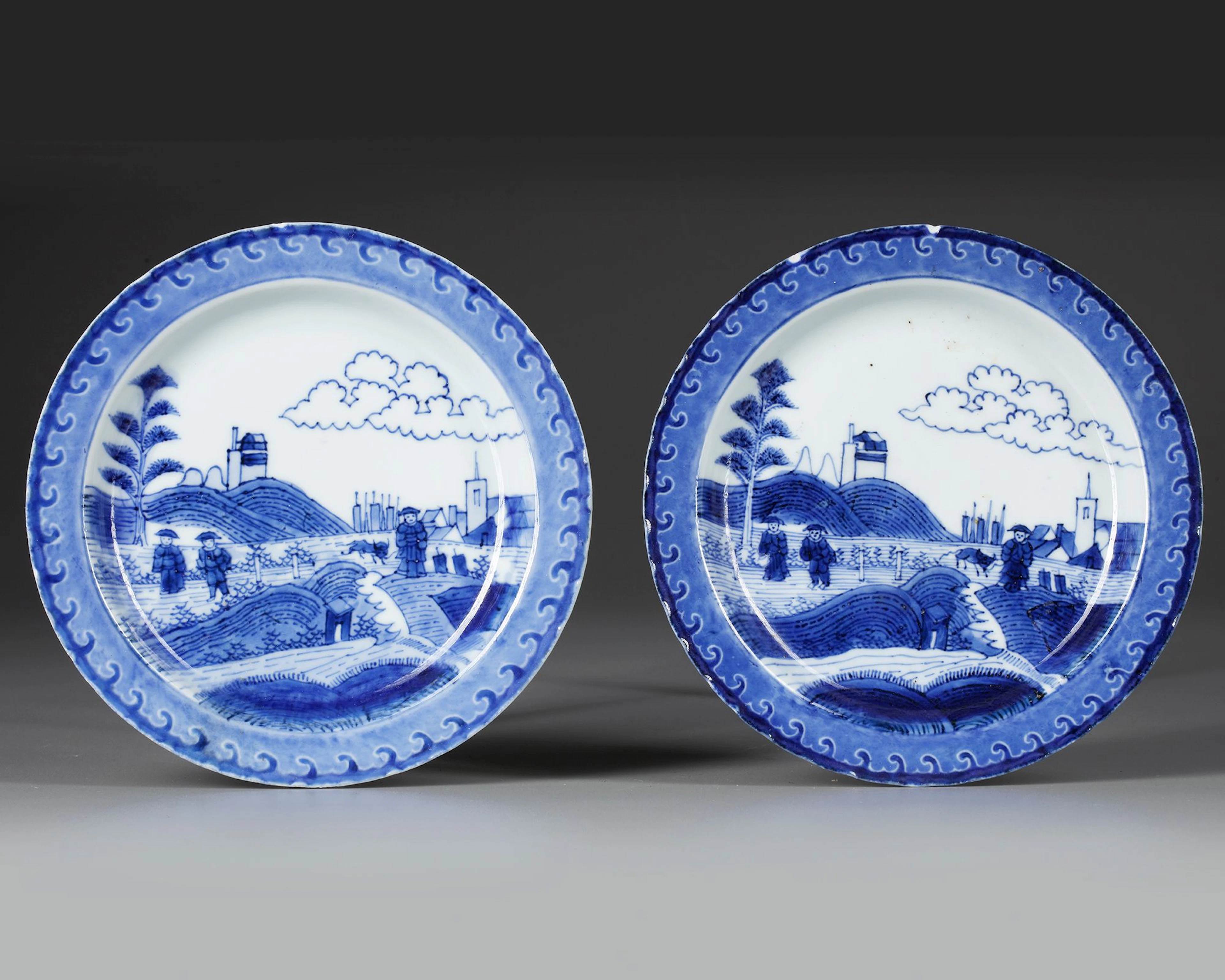 A PAIR OF CHINESE BLUE AND WHITE 'SCHEVENINGEN' PLATES, KANGXI (1662-1722)