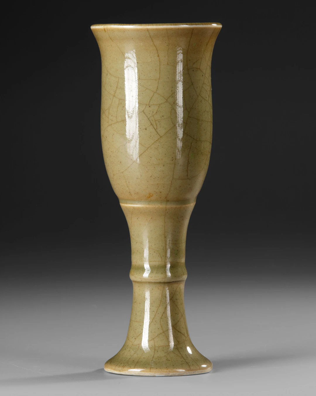 A CHINESE QIANLONG CELADON-GLAZED STEM CUP, QIANLONG MARK AND OF THE PERIOD