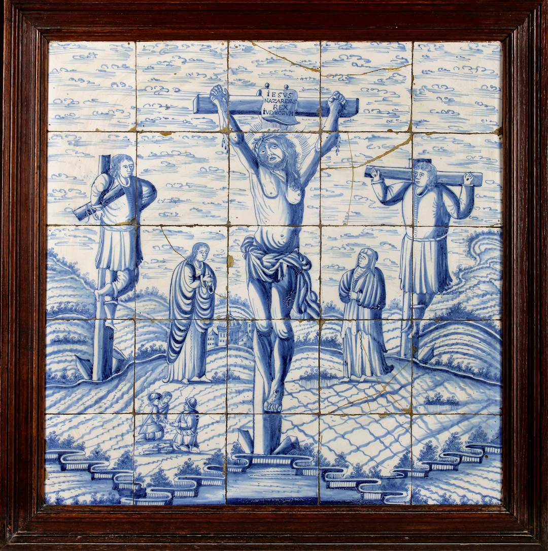 A BLUE AND WHITE DELFT TILE PANEL DEPICTING THE CRUCIFIXION, SECOND