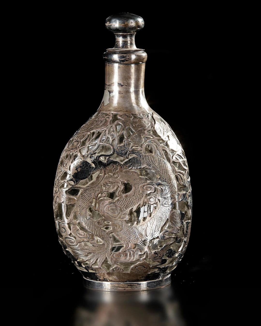 A CHINESE SILVER-OVERLAID GLASS BOTTLE, 19TH CENTURY