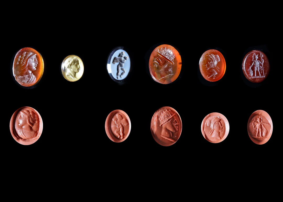A GROUP OF FIVE MIXED INTAGLIOS, SOME ANCIENT, ONE GLASS PORTRAIT