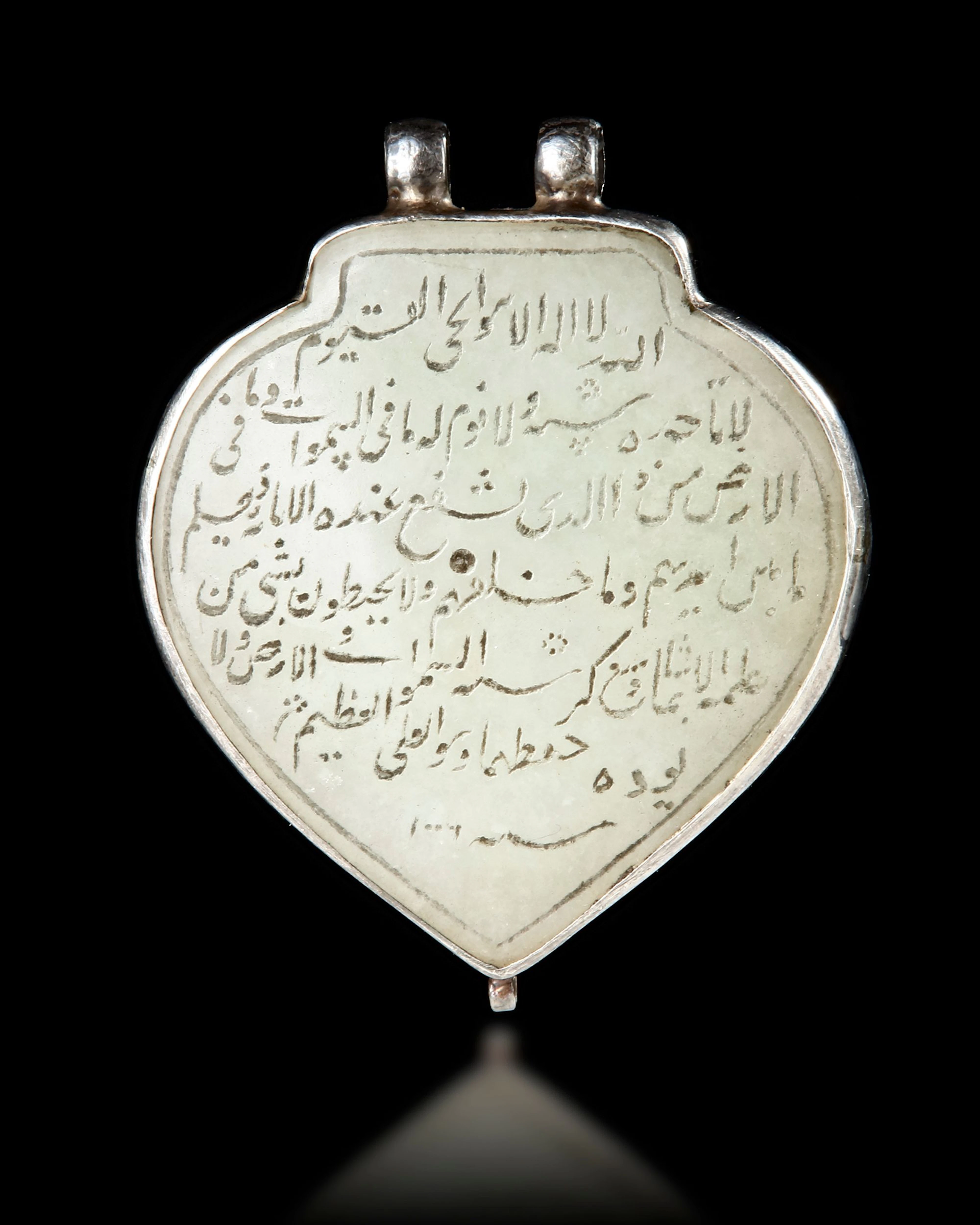A MUGHAL CALLIGRAPHIC JADE PENDANT (HALDILI), INDIA, DATED 1006 AH/1598 AD
