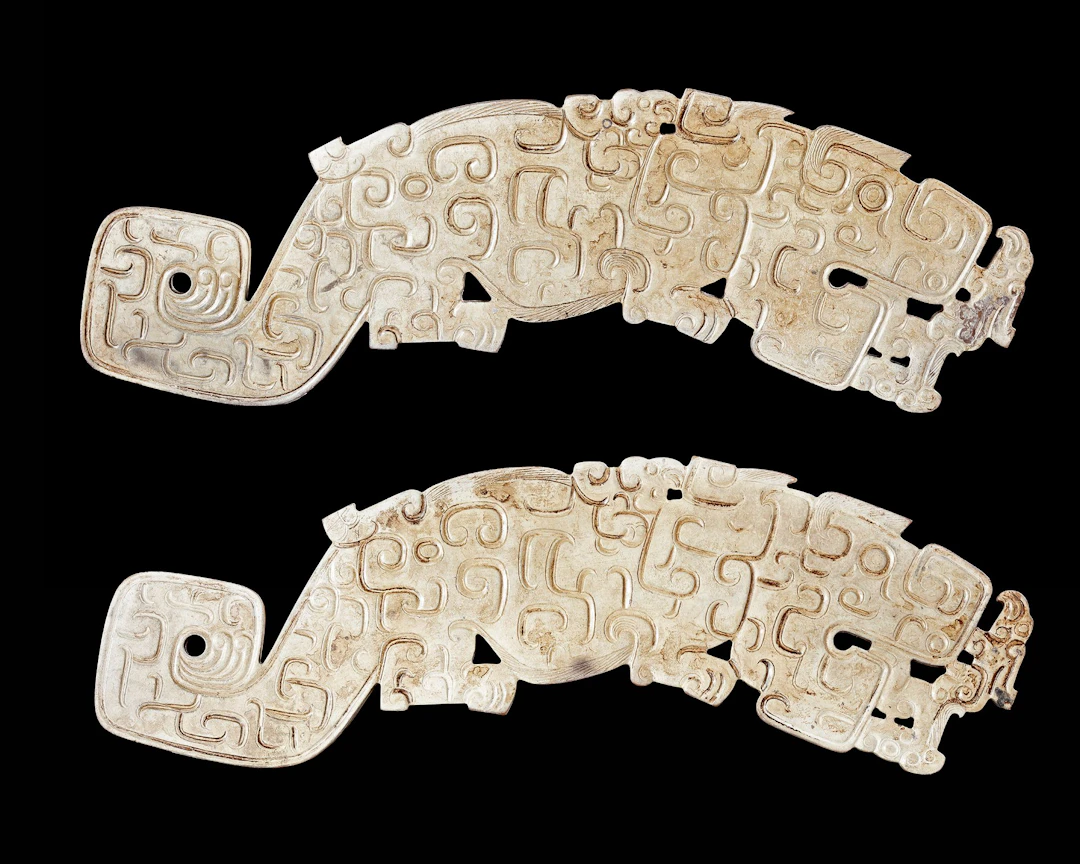 A PAIR OF WHITE LARGE JADE TIGERS, CHINA, SPRING AND AUTUMN PERIOD (770–476 BC)