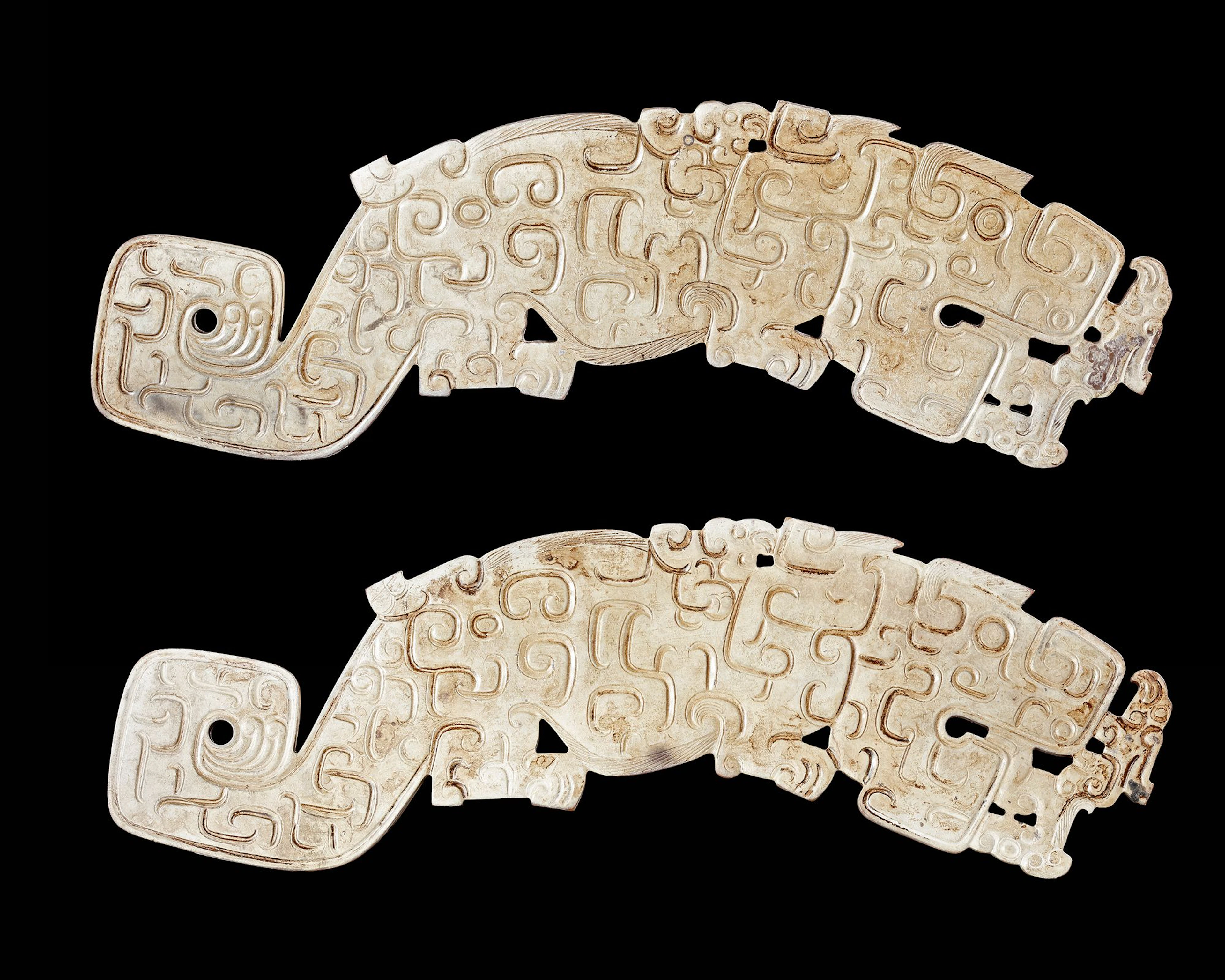 A PAIR OF WHITE LARGE JADE TIGERS, CHINA, SPRING AND AUTUMN PERIOD (770–476 BC)
