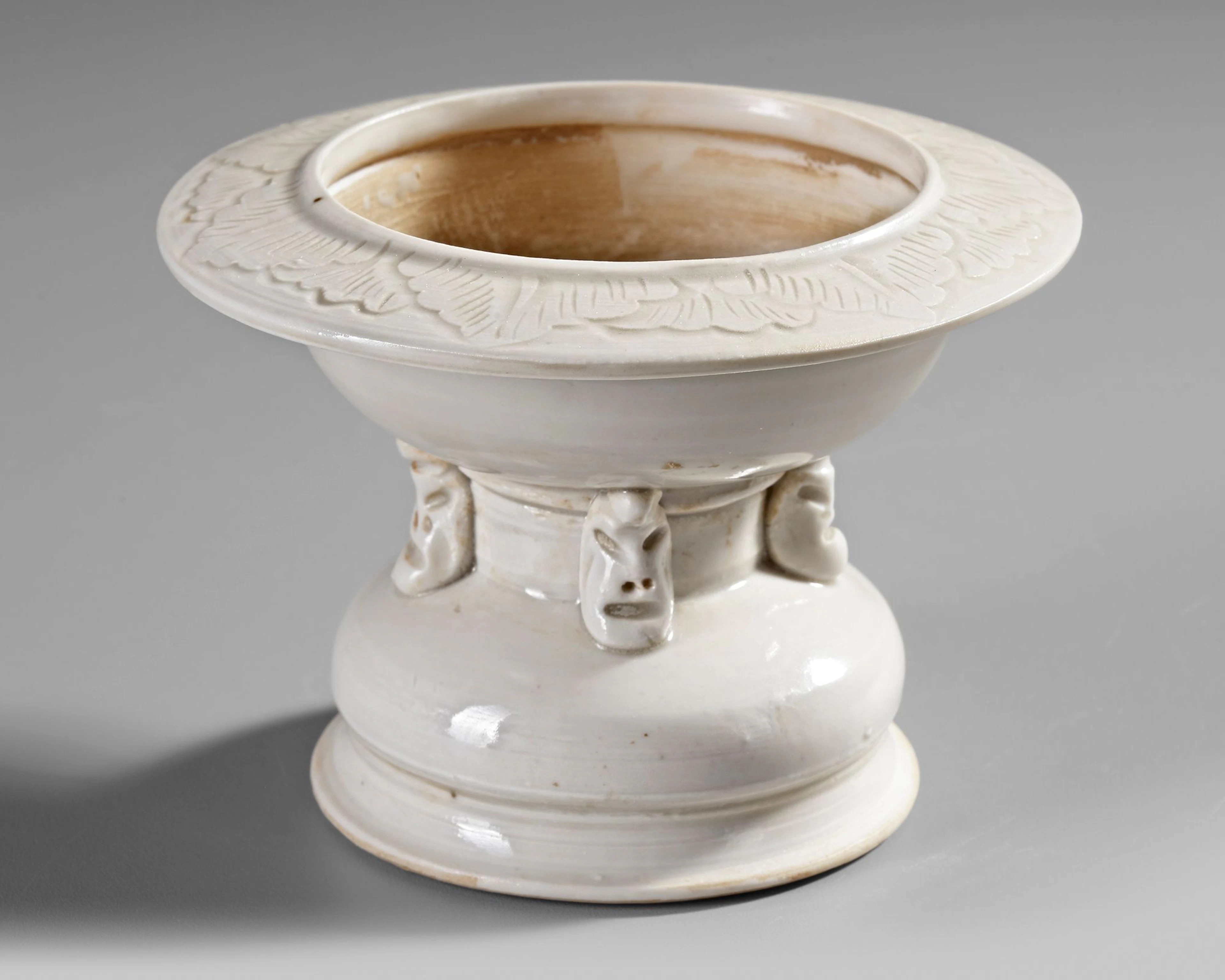A CHINESE WHITE-GLAZED ALTAR STAND OR INCENSE HOLDER, SONG DYNASTY (960-1279)