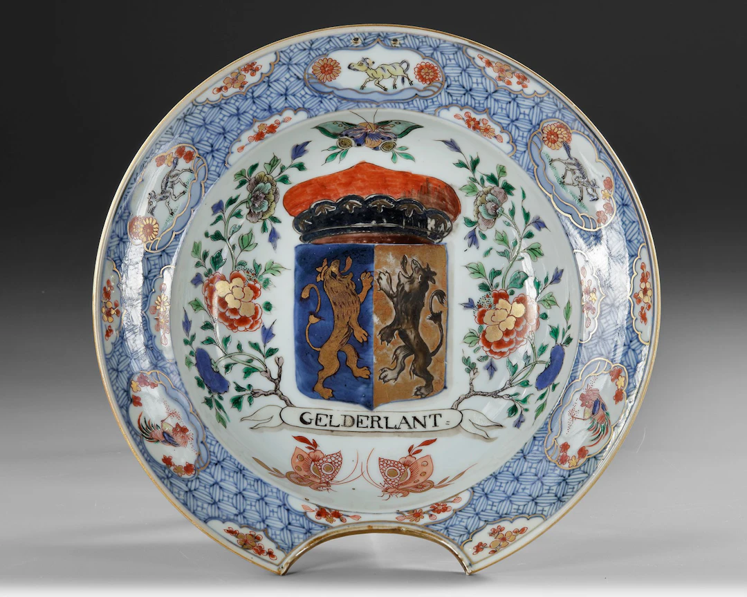 A CHINESE FAMILLE VERTE ‘PROVINCES’ ARMORIAL SHAVING BOWL, WITH THE