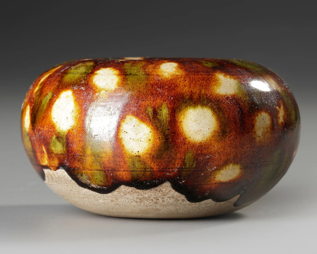 A CHINESE SANCAI GLAZED WATERPOT, TANG DYNASTY (618-907)