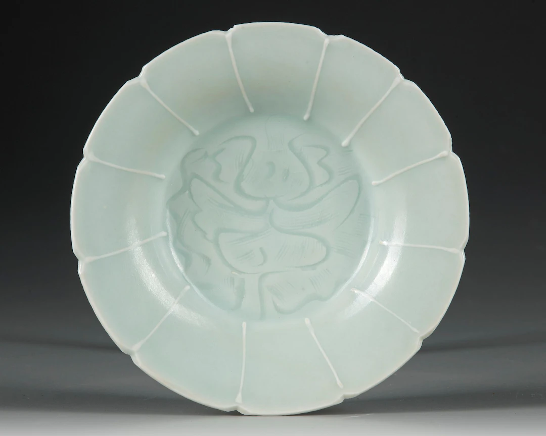 A CHINESE QINGBAI LOBED 'FLORAL' DISH, SONG DYNASTY (960-1279 AD)