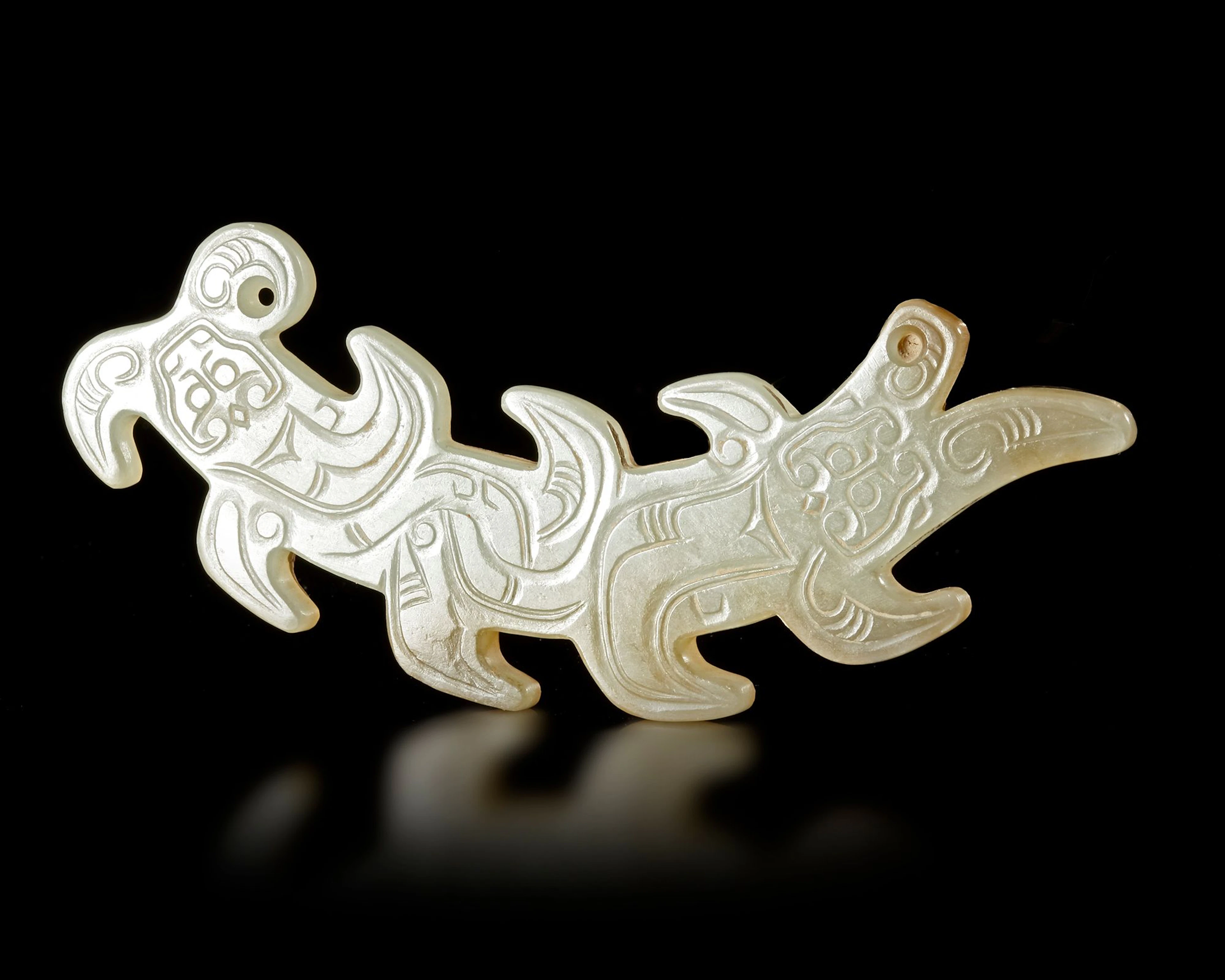 A WHITE JADE "KUI' DRAGON PENDANT, CHINA, WESTERN ZHOU DYNASTY