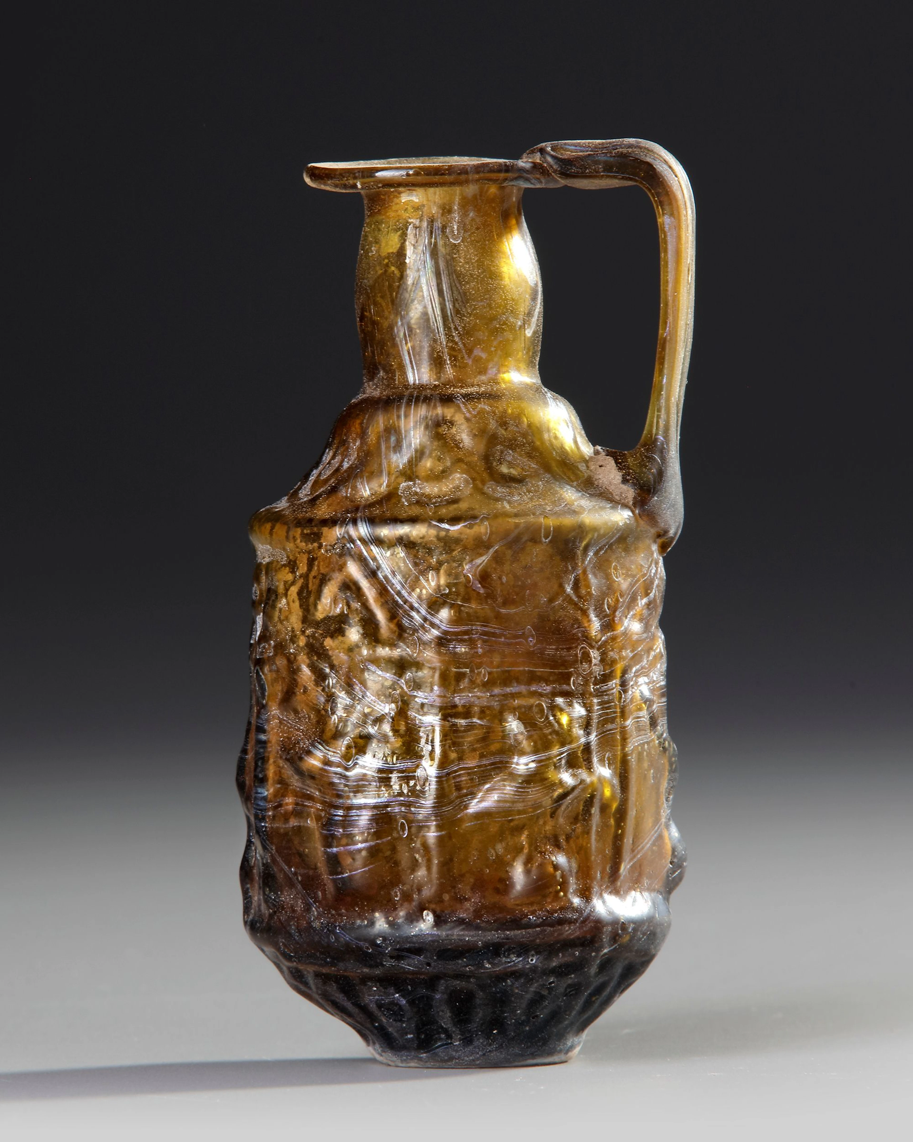 A SIDONIAN MOLD-BLOWN EWER, SIDON, 1ST CENTURY AD
