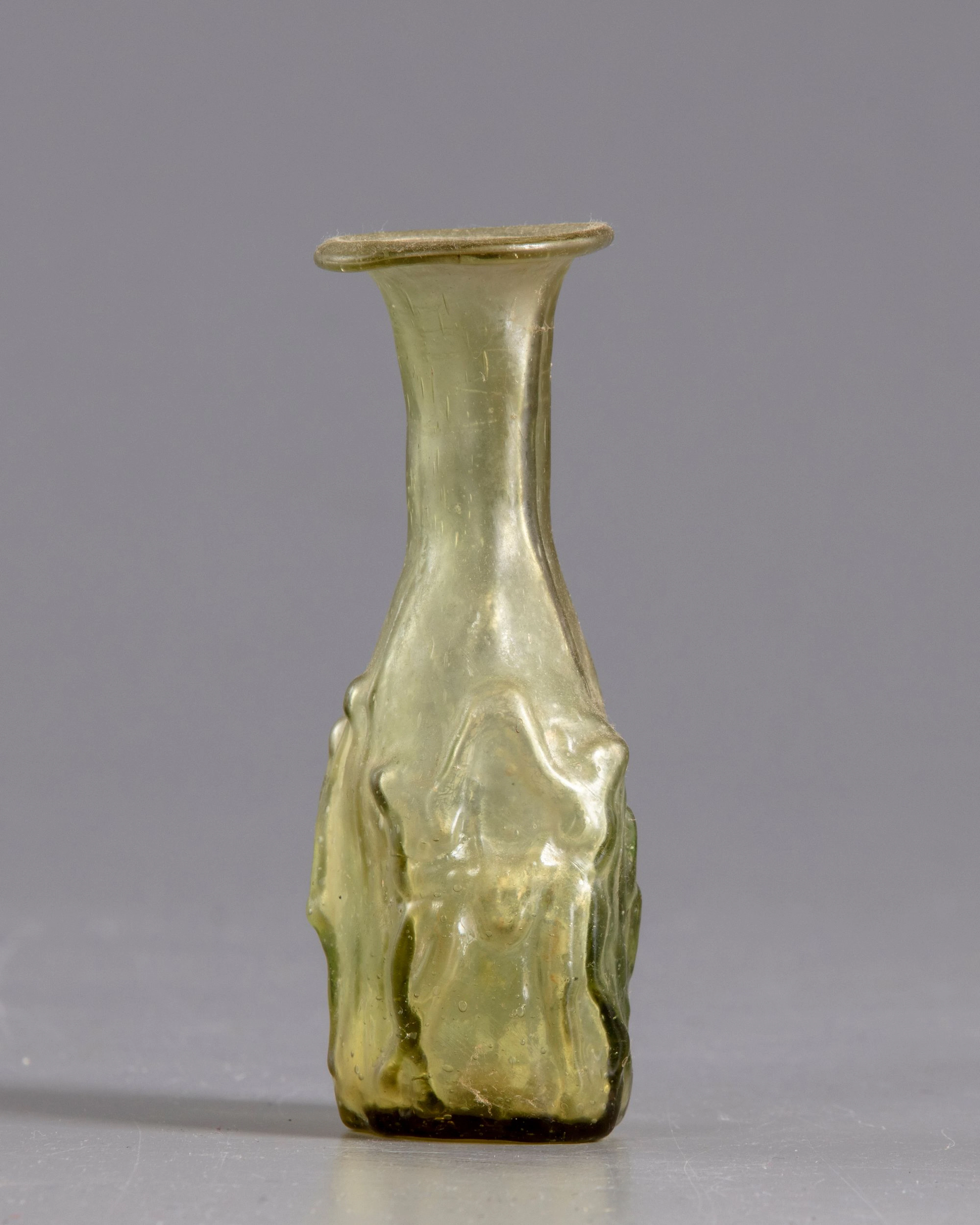 A ROMAN GLASS FLASK, CIRCA 3RD CENTURY AD