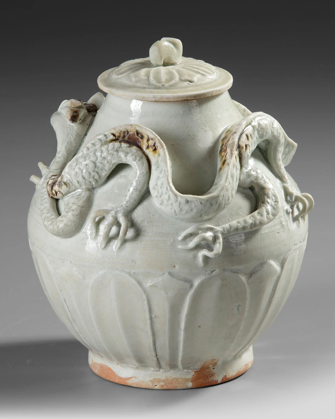 A CHINESE WHITE-GLAZED DRAGON JAR AND COVER,SONG DYNASTY (960-1279)