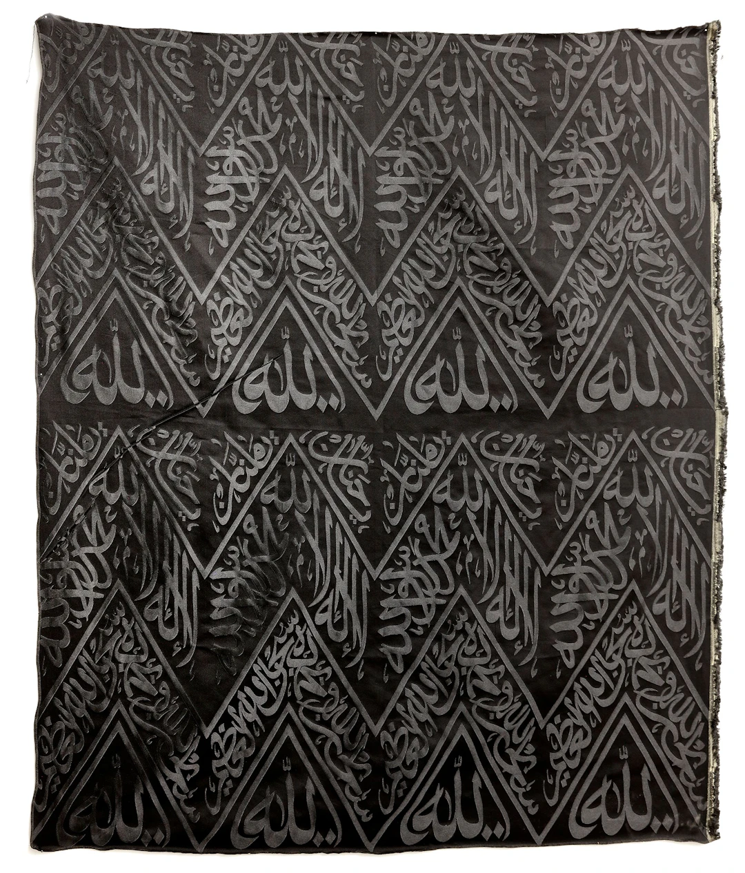 A BLACK KAABA KISWAH TEXTILE FRAGMENT, SAUDI ARABIA, 20TH CENTURY