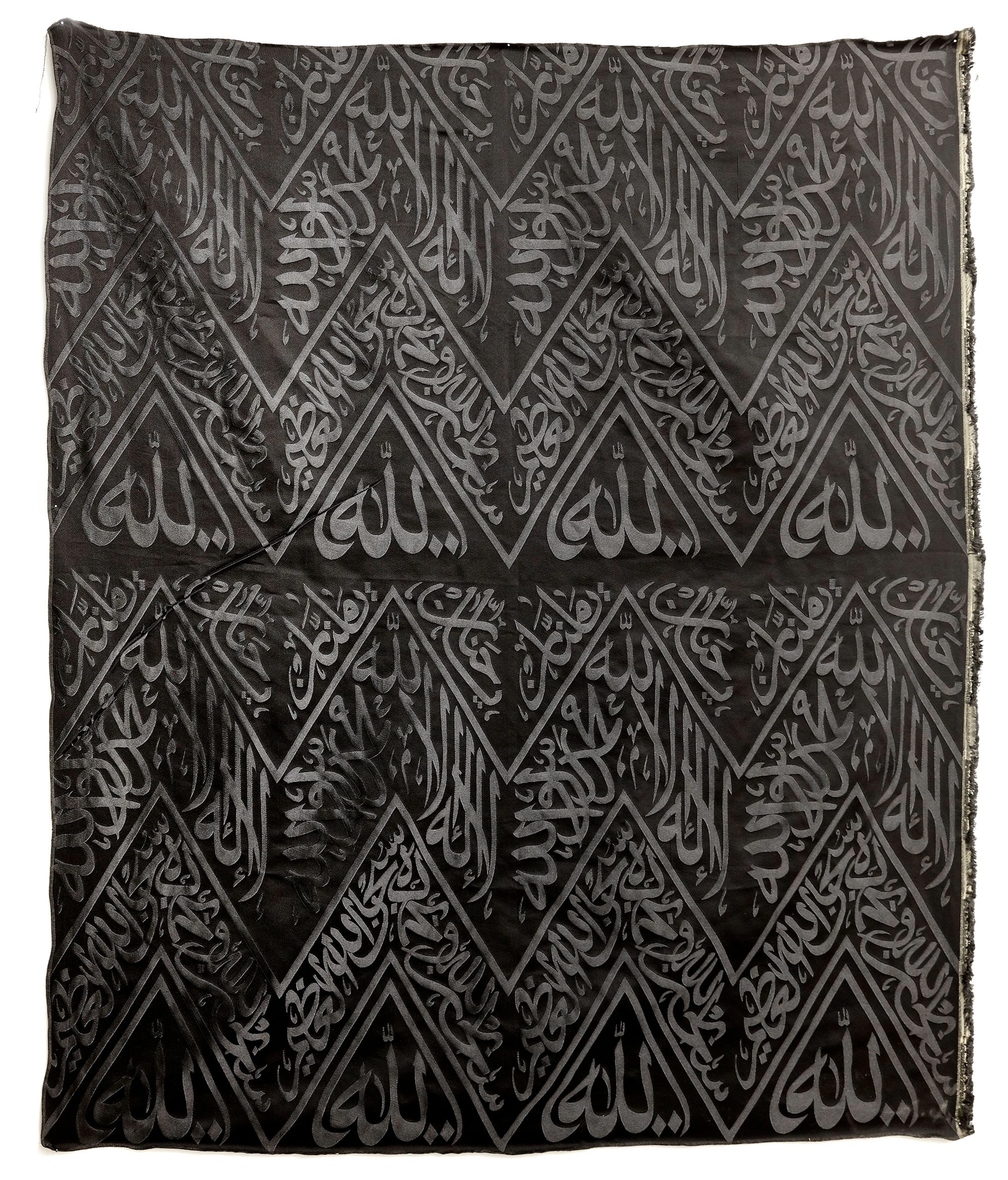 A BLACK KAABA KISWAH TEXTILE FRAGMENT, SAUDI ARABIA, 20TH CENTURY