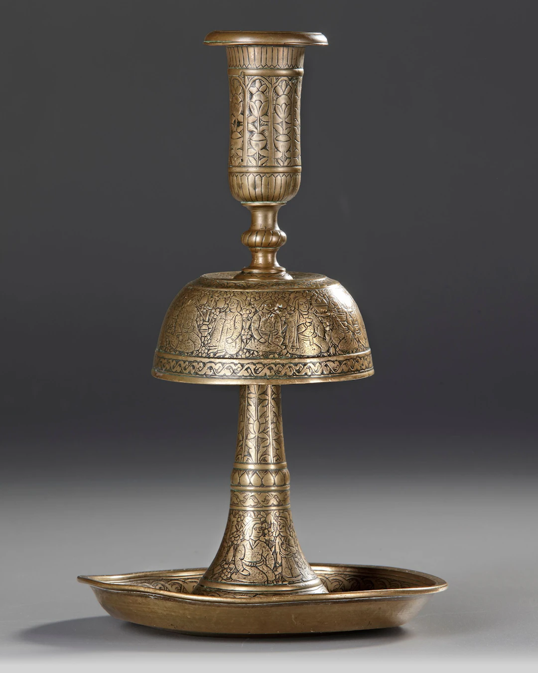 A ZAND ENGRAVED BRASS CANDLESTICK, PERSIA, 18TH CENTURY