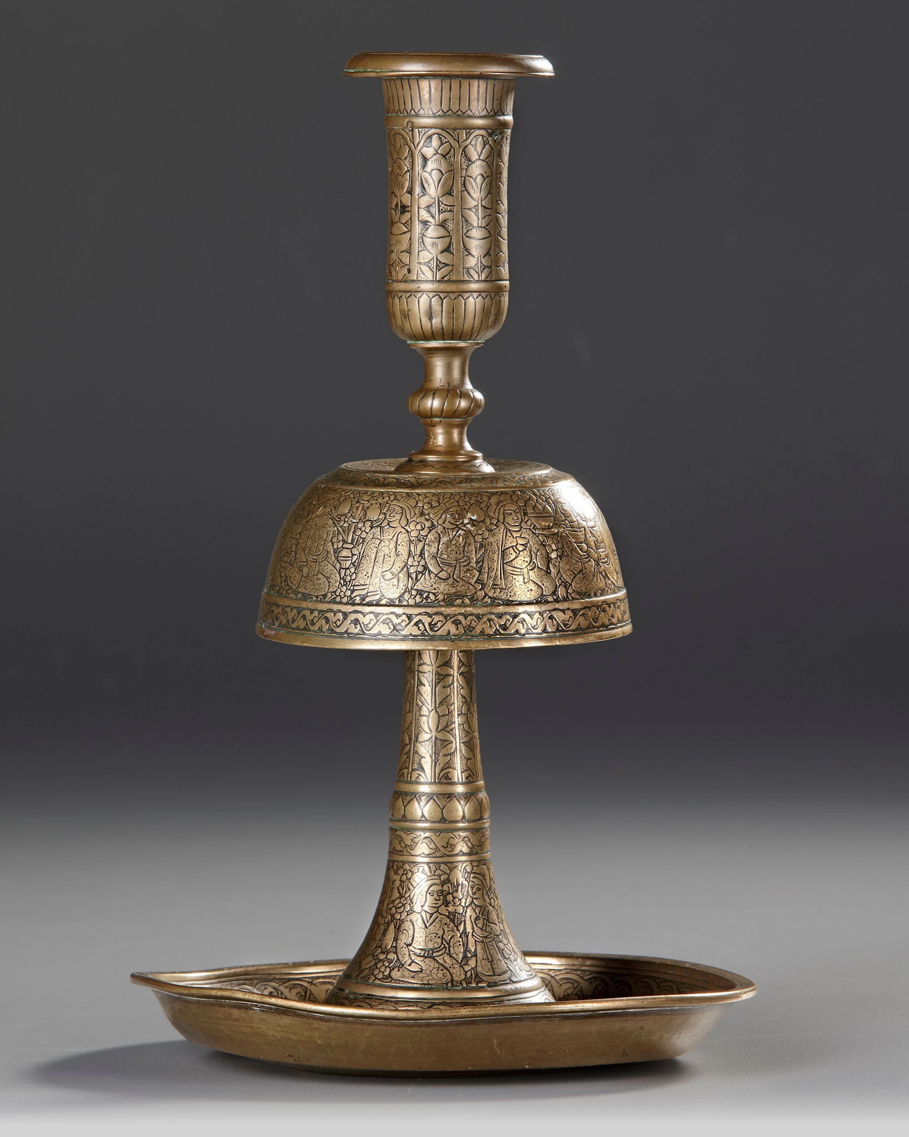 A ZAND ENGRAVED BRASS CANDLESTICK, PERSIA, 18TH CENTURY