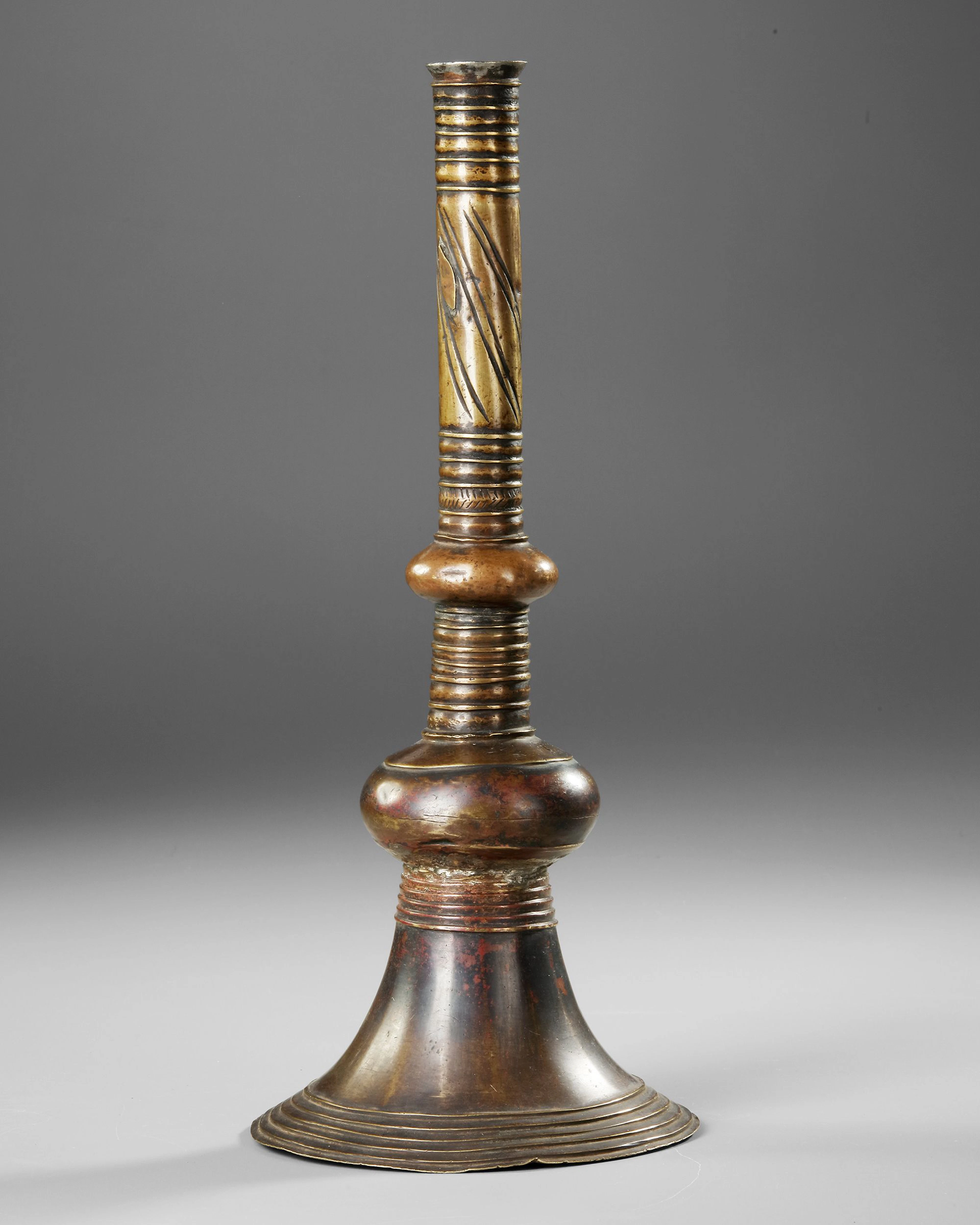 A CANDLESTICK, YEMEN, 16TH CENTURY