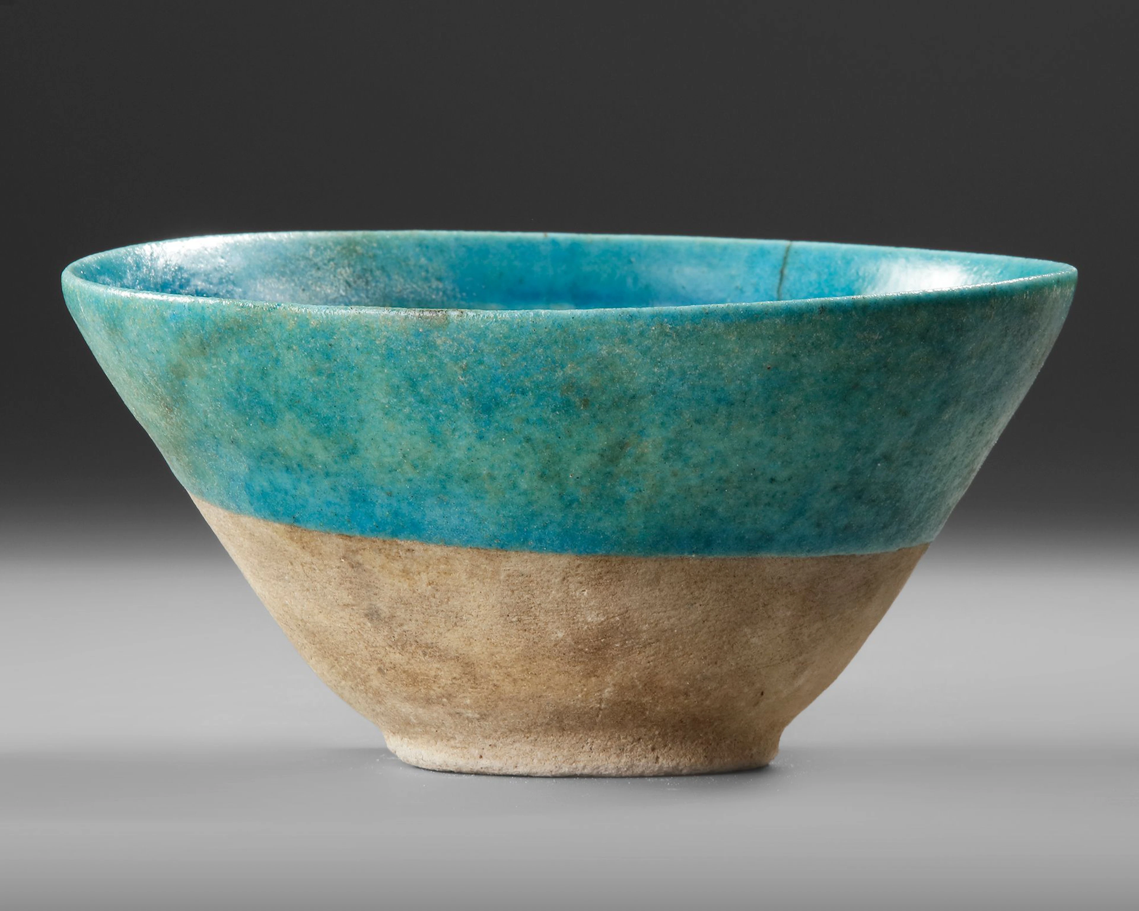 A BAMIYAN MONOCHROME MOULDED POTTERY BOWL, PERSIA, 12TH-13TH CENTURY