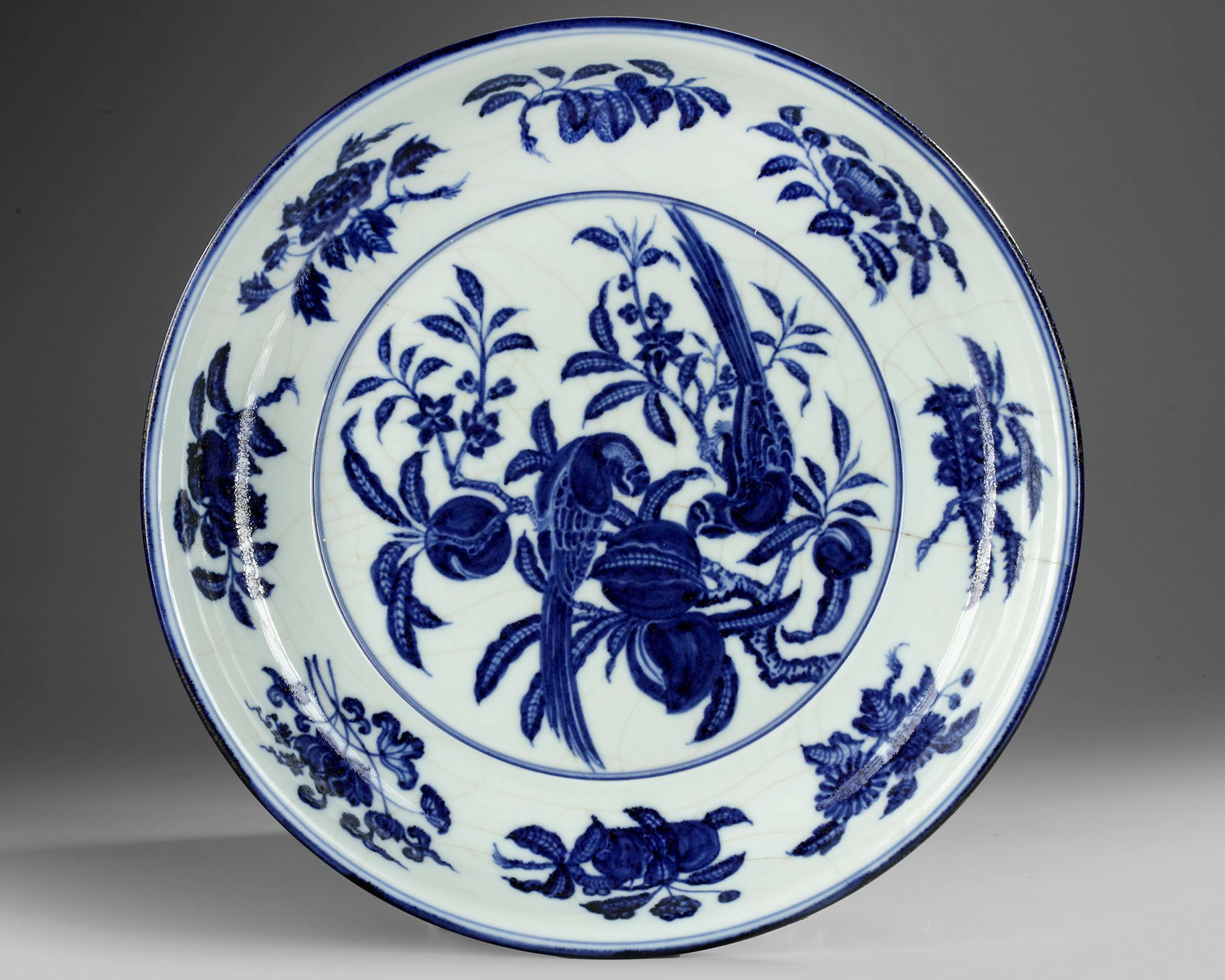 A CHINESE BLUE AND WHITE 'BIRDS' CHARGER, QING DYNASTY (1644–1911)