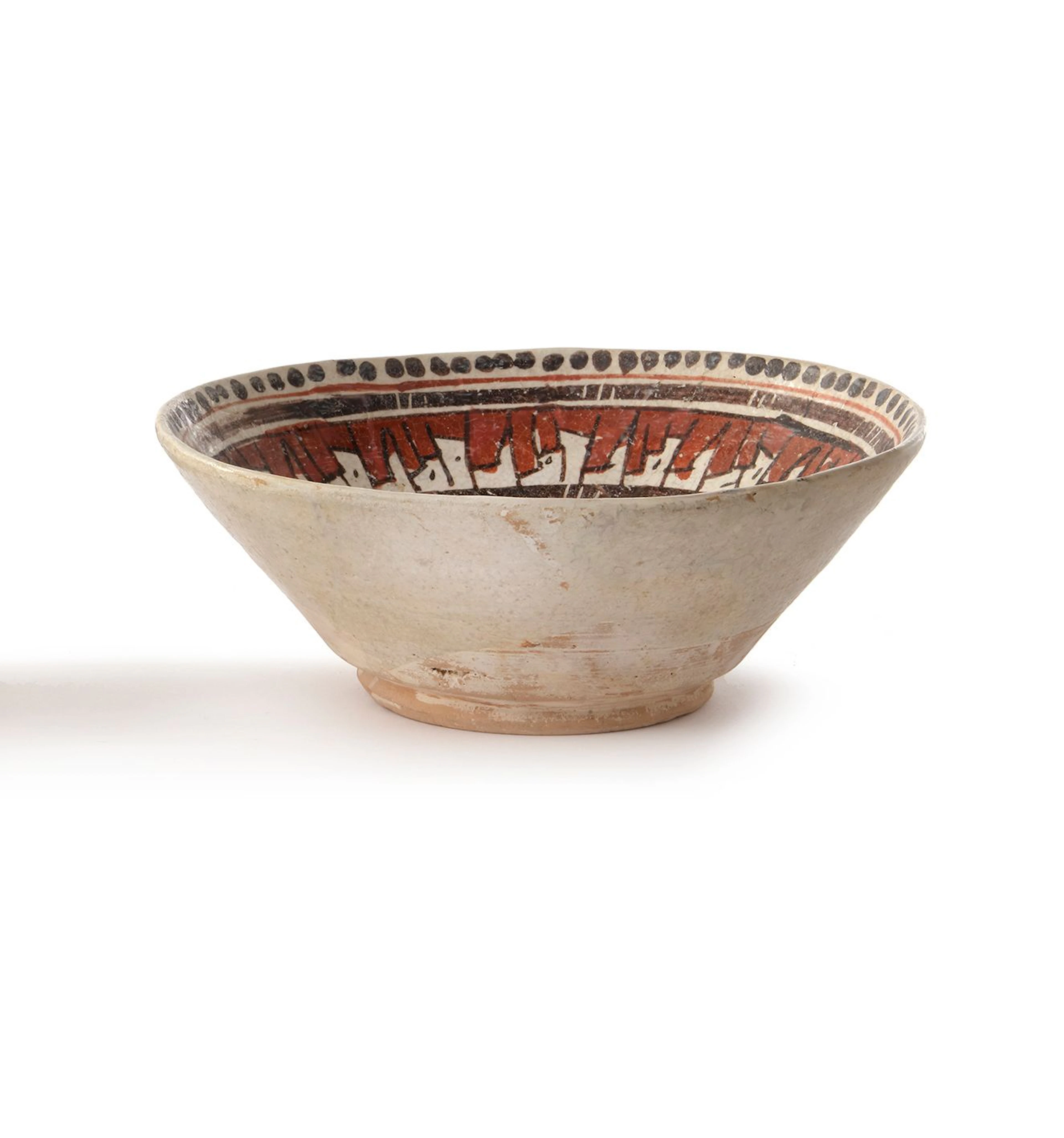 A NISHAPUR SLIP-PAINTED POTTERY BOWL, 9TH-10TH CENTURY