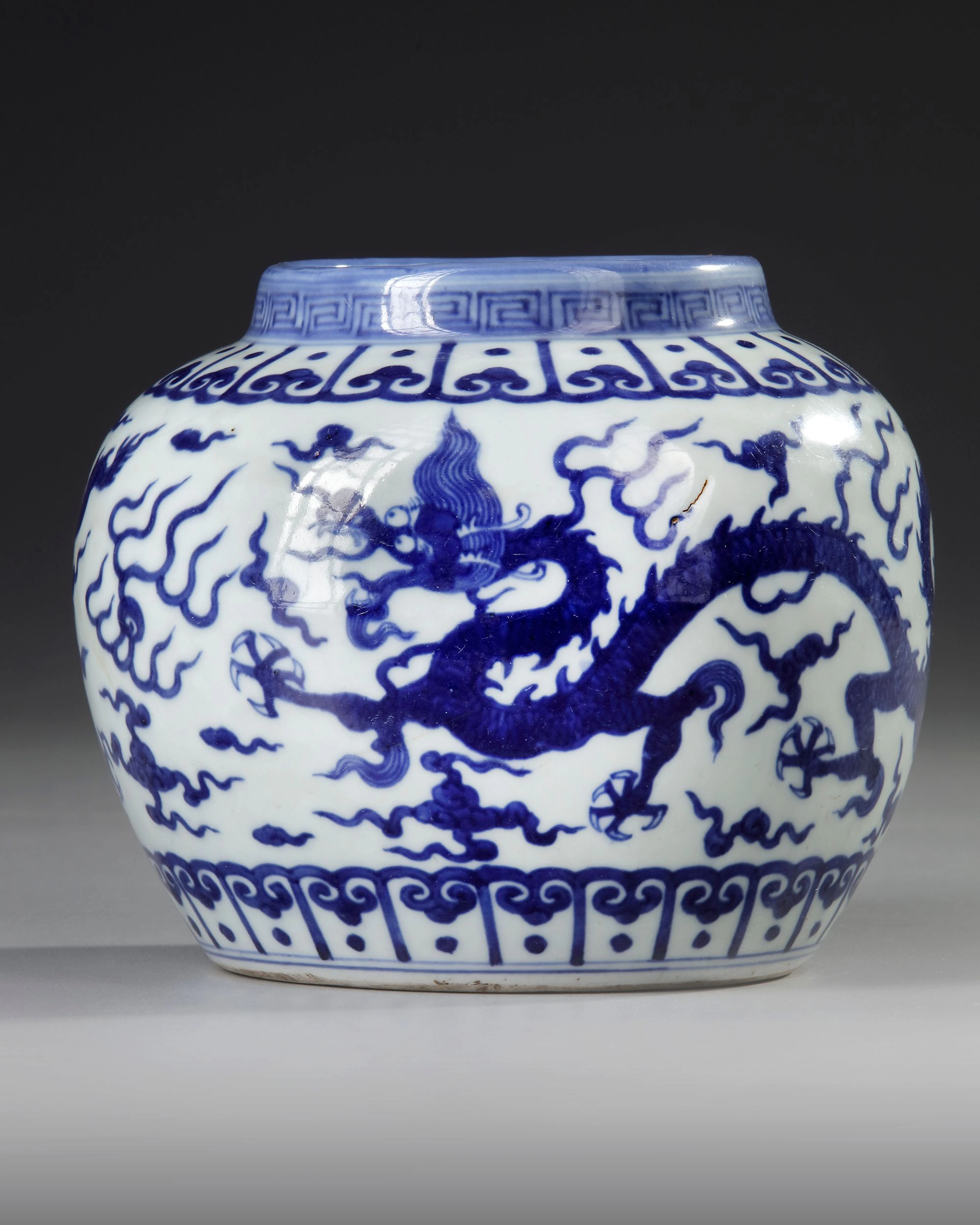 A CHINESE BLUE AND WHITE DRAGONS JAR, MING DYNASTY (1368-1644)