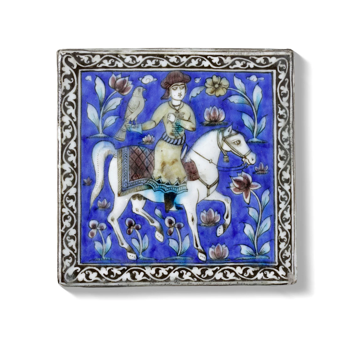 A POLYCHROME MOULDED POTTERY TILE, PERSIA QAJAR, 19TH CENTURY