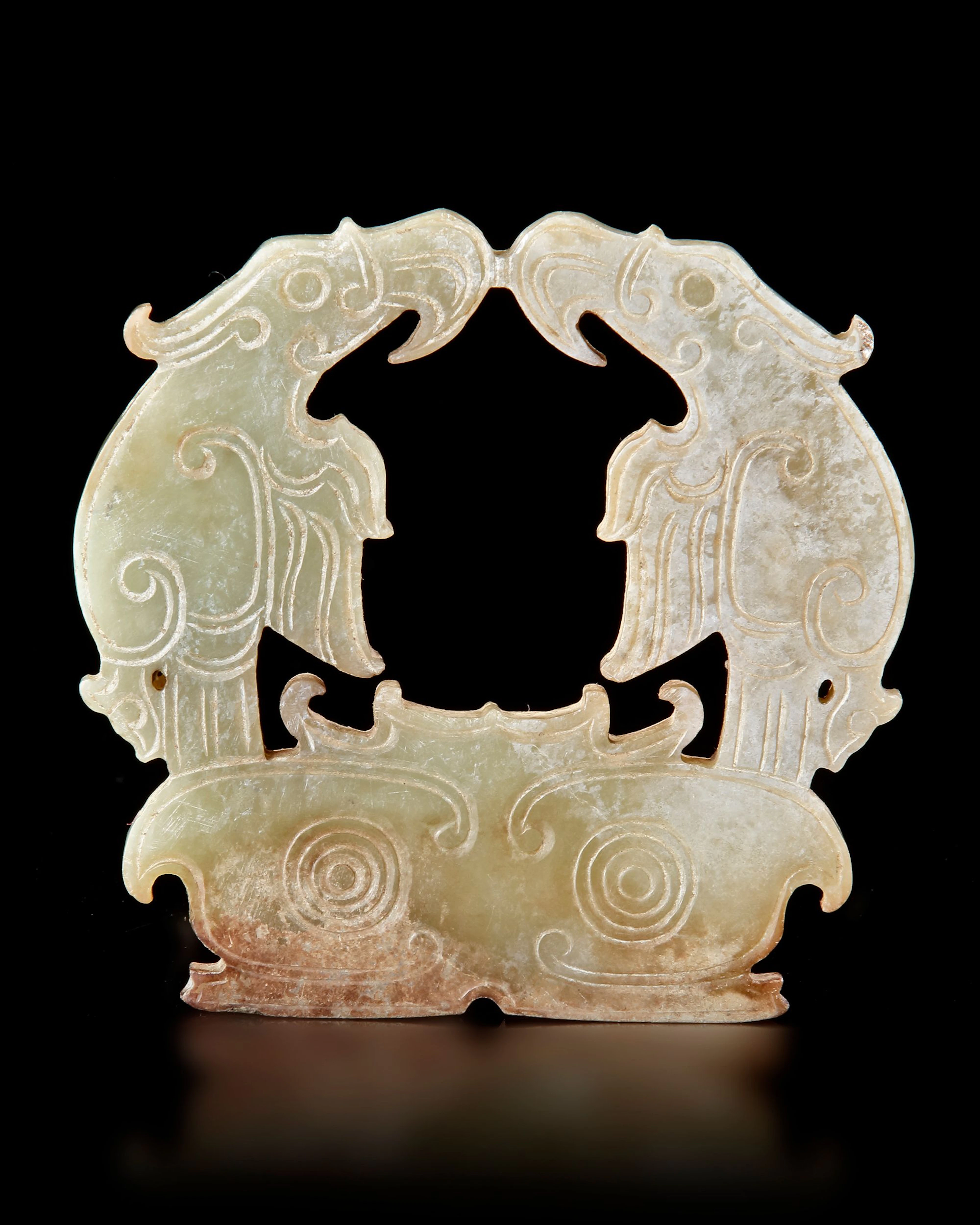 A CHINESE GREEN JADE TWIN-EAGLE PLAQUE, POST-SHIJIAHE CULTURE (CIRCA