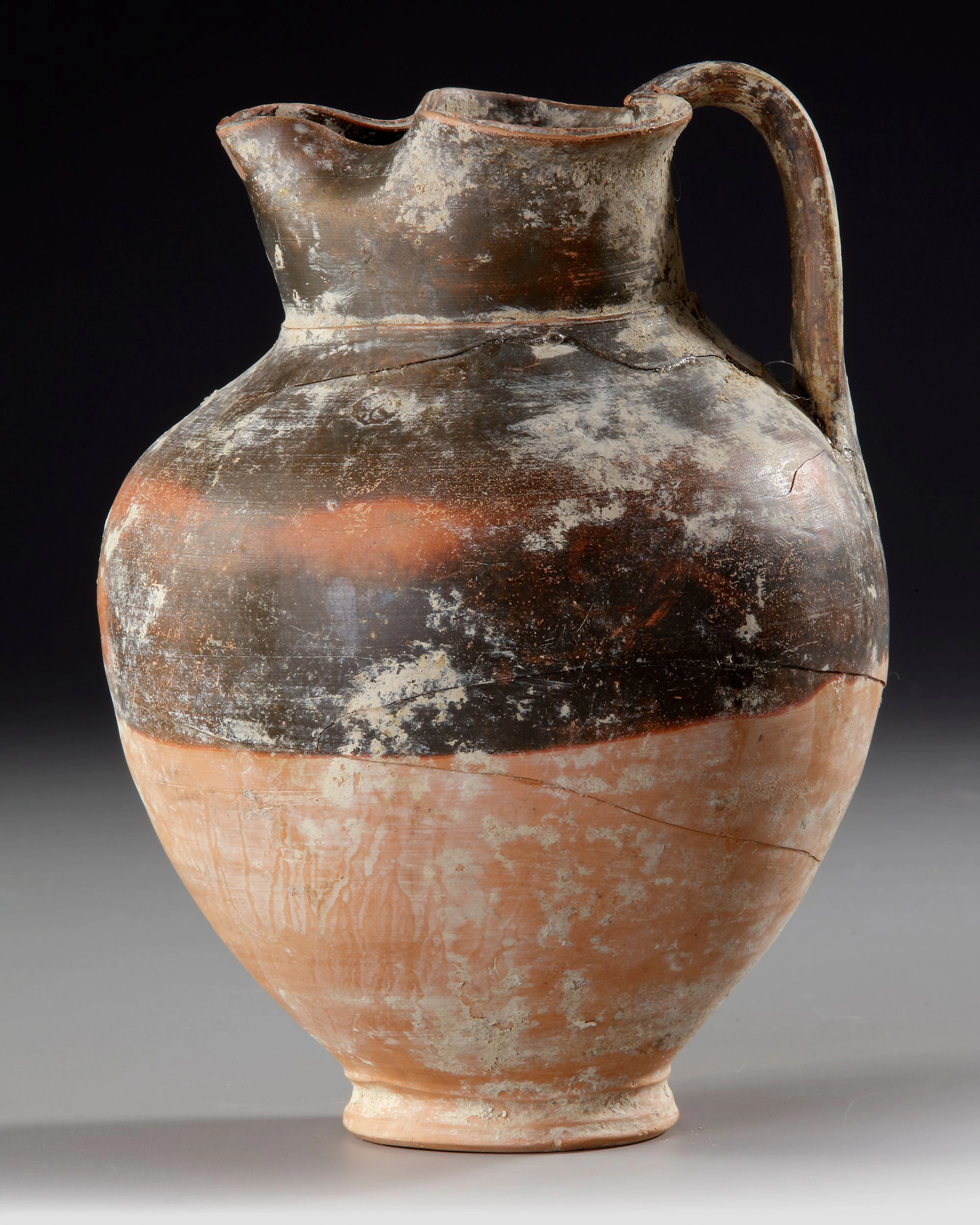 A GREEK OINOCHOE, RED AND BLACK, 3RD - 2ND CENTURY BC