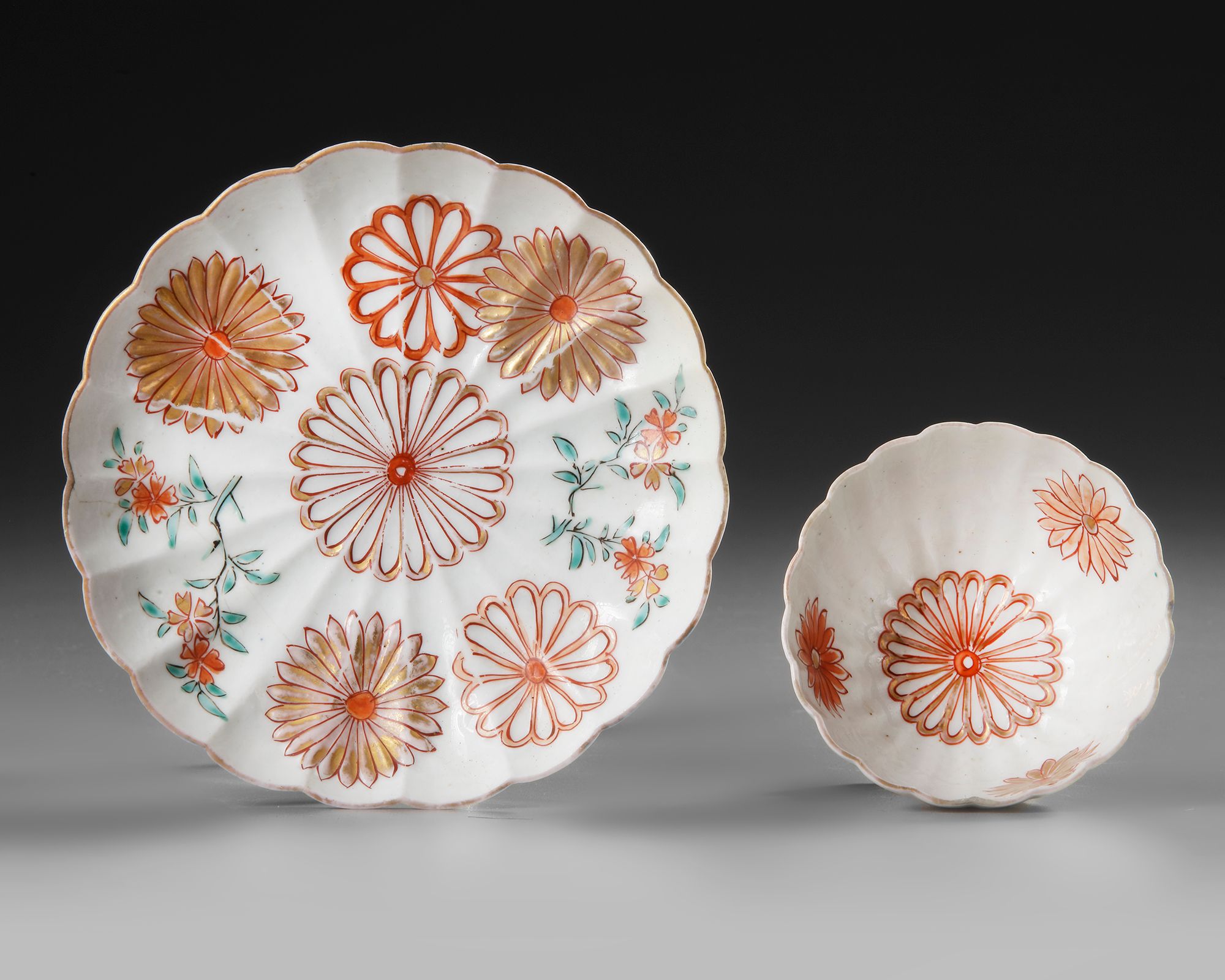 A JAPANESE ARITA PORCELAIN CUP AND SAUCER, EDO PERIOD, EARLY 18TH-CENTURY.